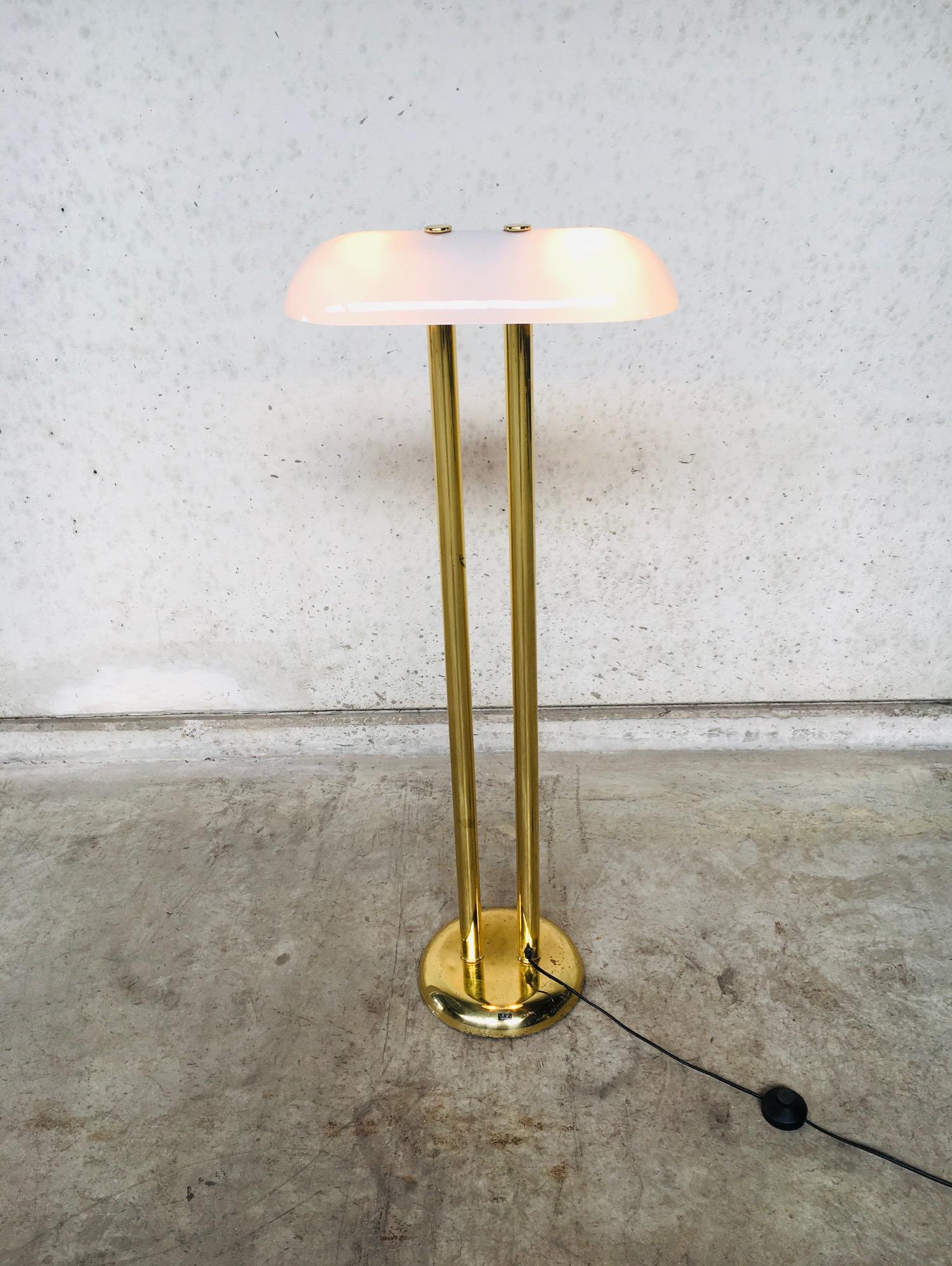Vintage Hollywood Regency Style Midcentury Modern Design Brass Floor Lamp by Vibia, made in Spain in the 1970's. Marked with a label sticker on the base. Brass twin colom base with white milk glass shade. All original and in good condition. The