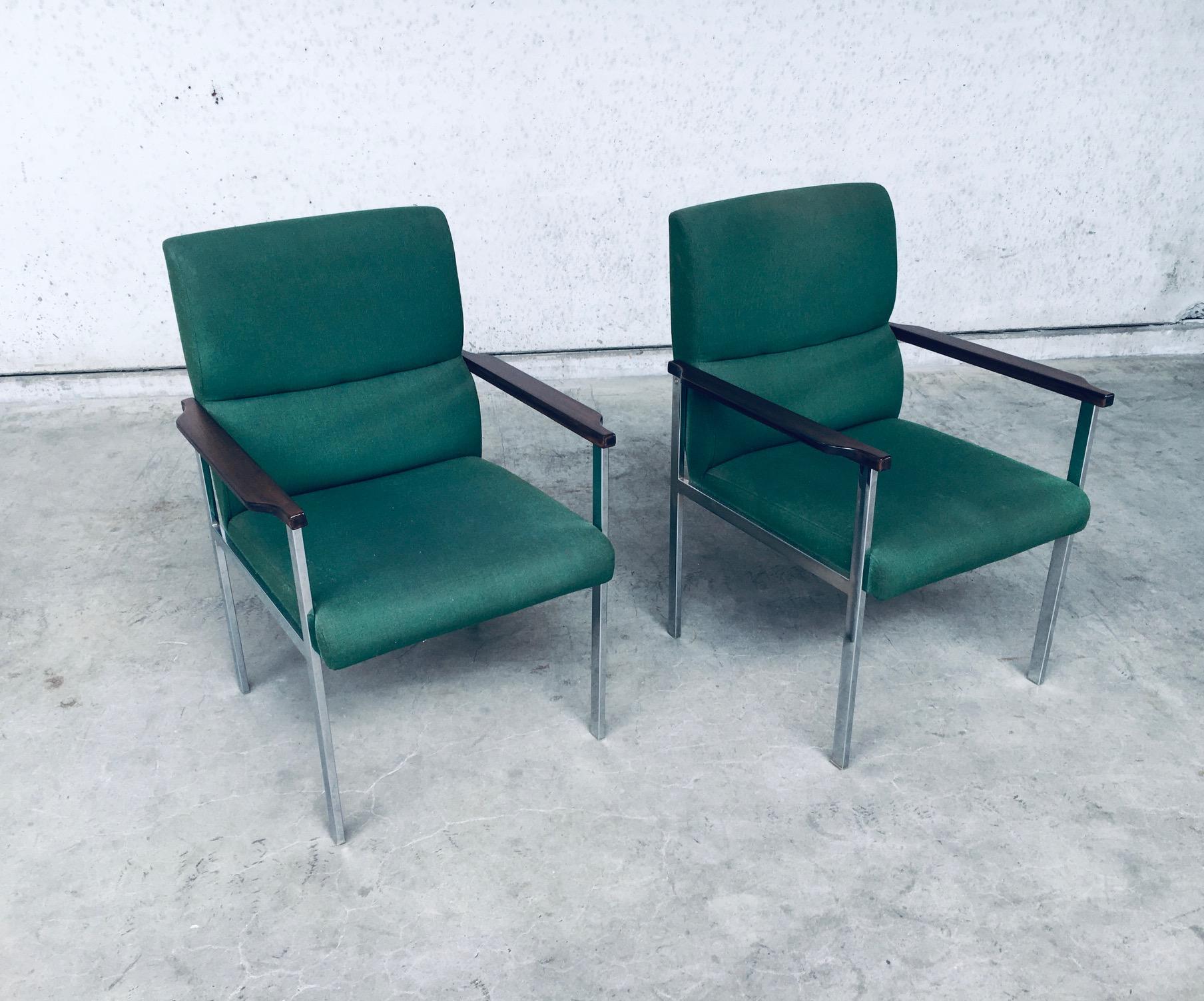 Vintage Midcentury Modern Design pair of Office Arm Chairs by Brune, made in Germany 1960's. Rare Chairs! Brune Label underneath the chair. Original green fabric with Palissander look wood arm rest on chrome metal frame. Both are in very good