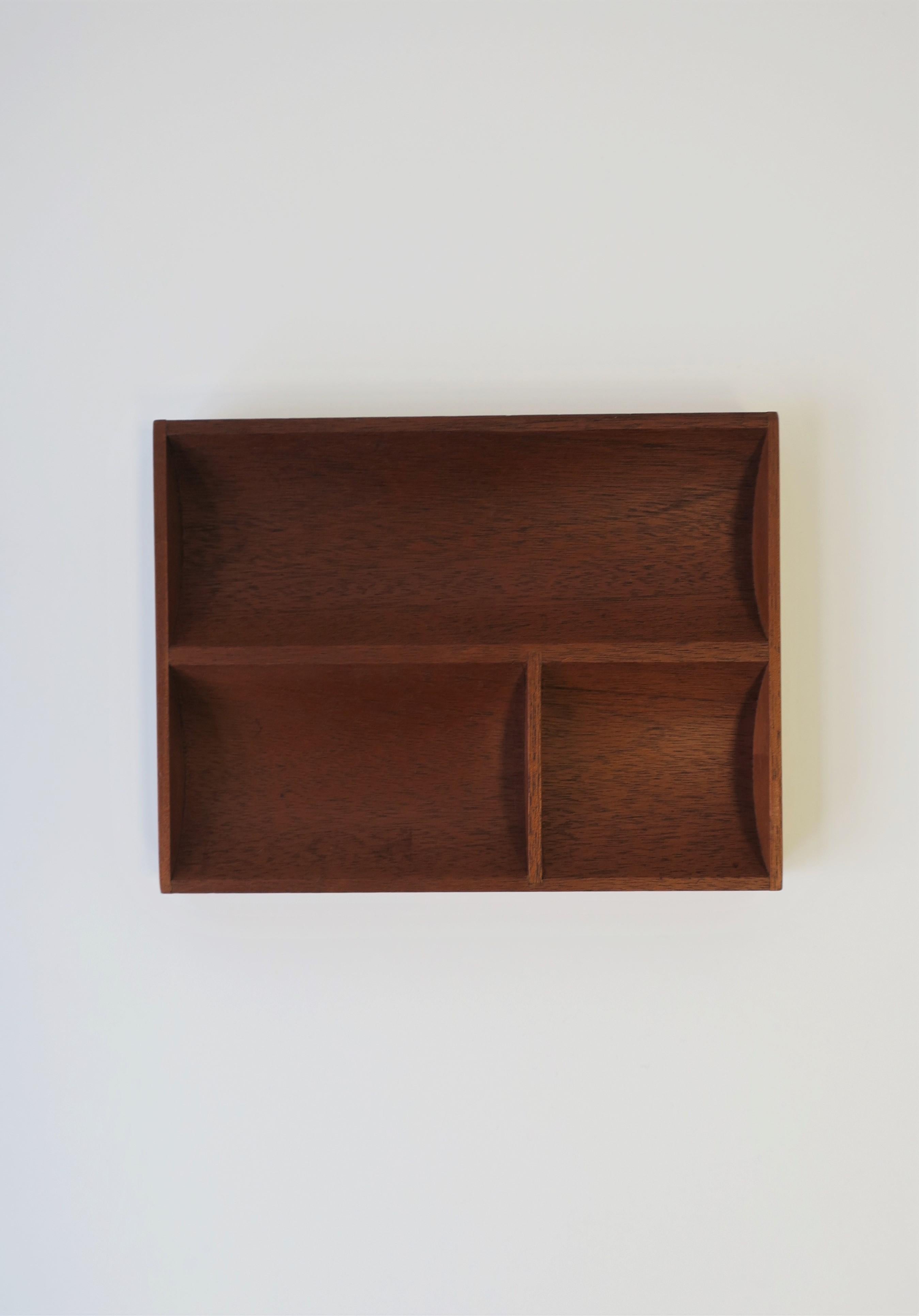 A Mid-Century Modern period or Minimalist style desk or vanity teak wood tray organizer. Piece has three compartment and can work well on a desk or on a vanity, nightstand table, walk-in-closet, etc., for jewelry and more as demonstrated in images.