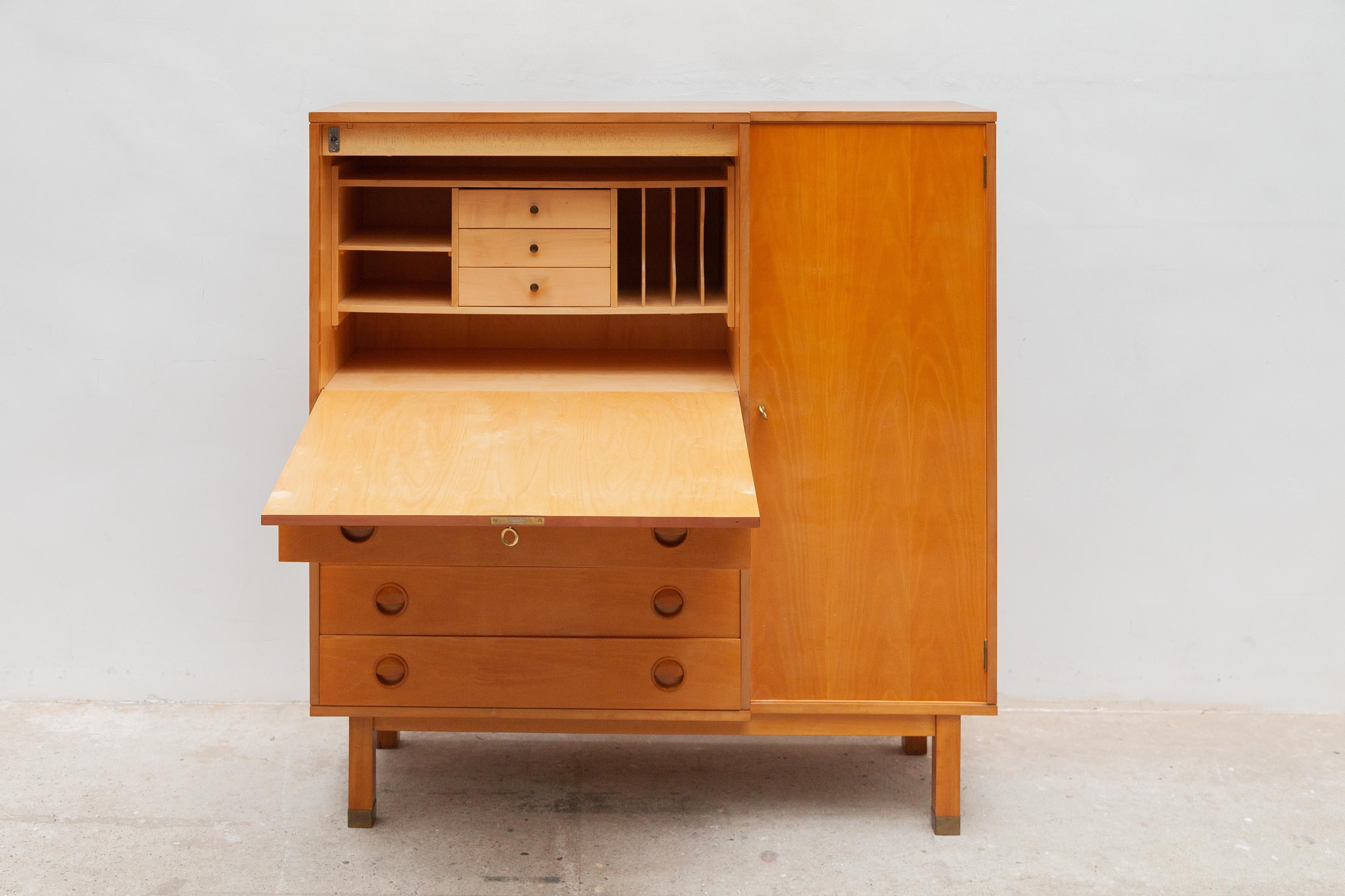 Vintage Mid-Century Modern desk sideboard, bureau secretaire.The honey-colored sideboard desk has been made of an ash veneer wood and brass feet. It contains plenty of storage space an open storage space with an integrated filing desk to organize
