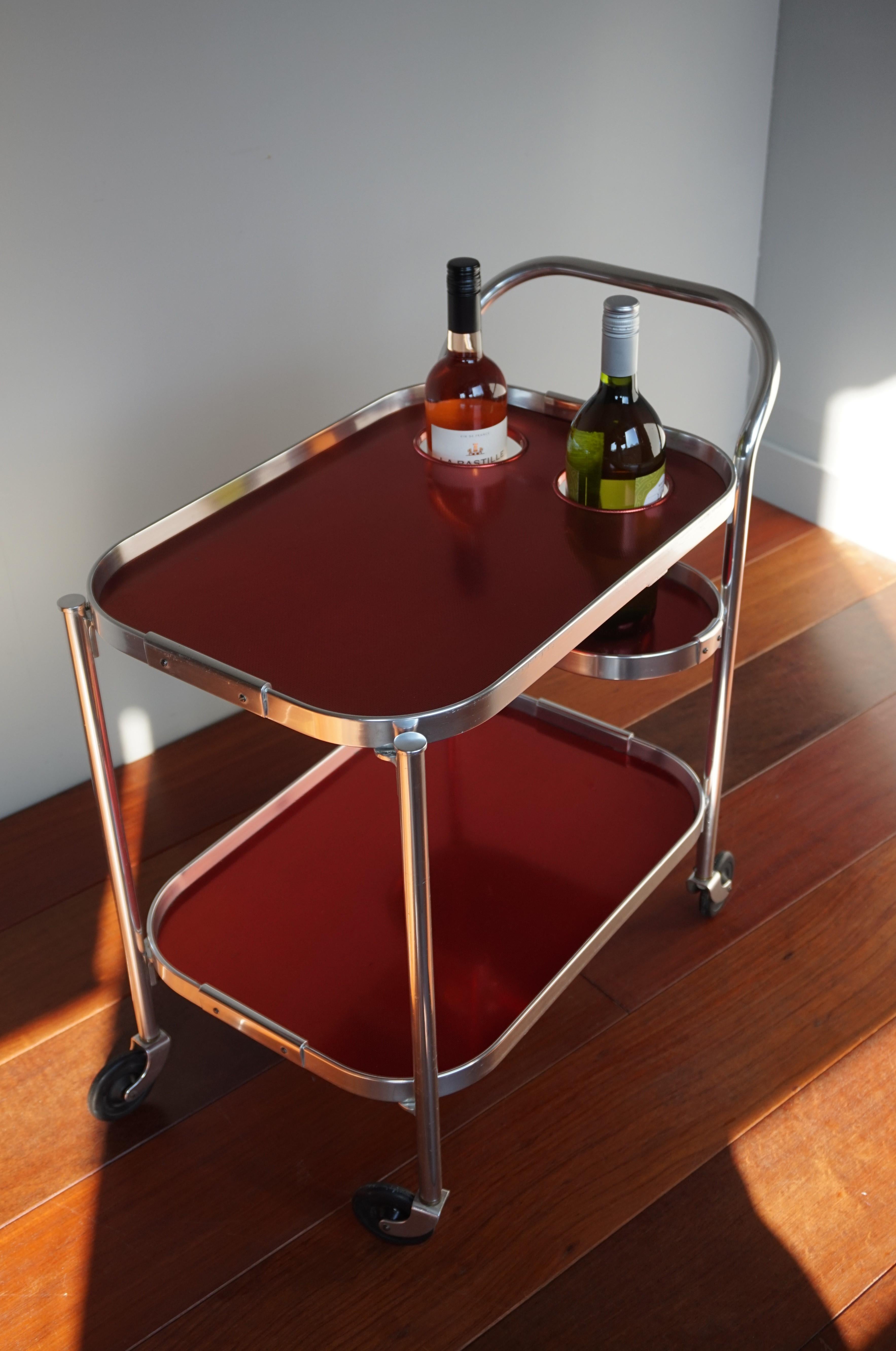 Practical size and very cool looking Mid-Century Modern bar cart.

If you have a midcentury or an even more contemporary interior, then this rare 1960s drinks cart by Kaymet of England could be gracing your home soon. This certainly is the coolest