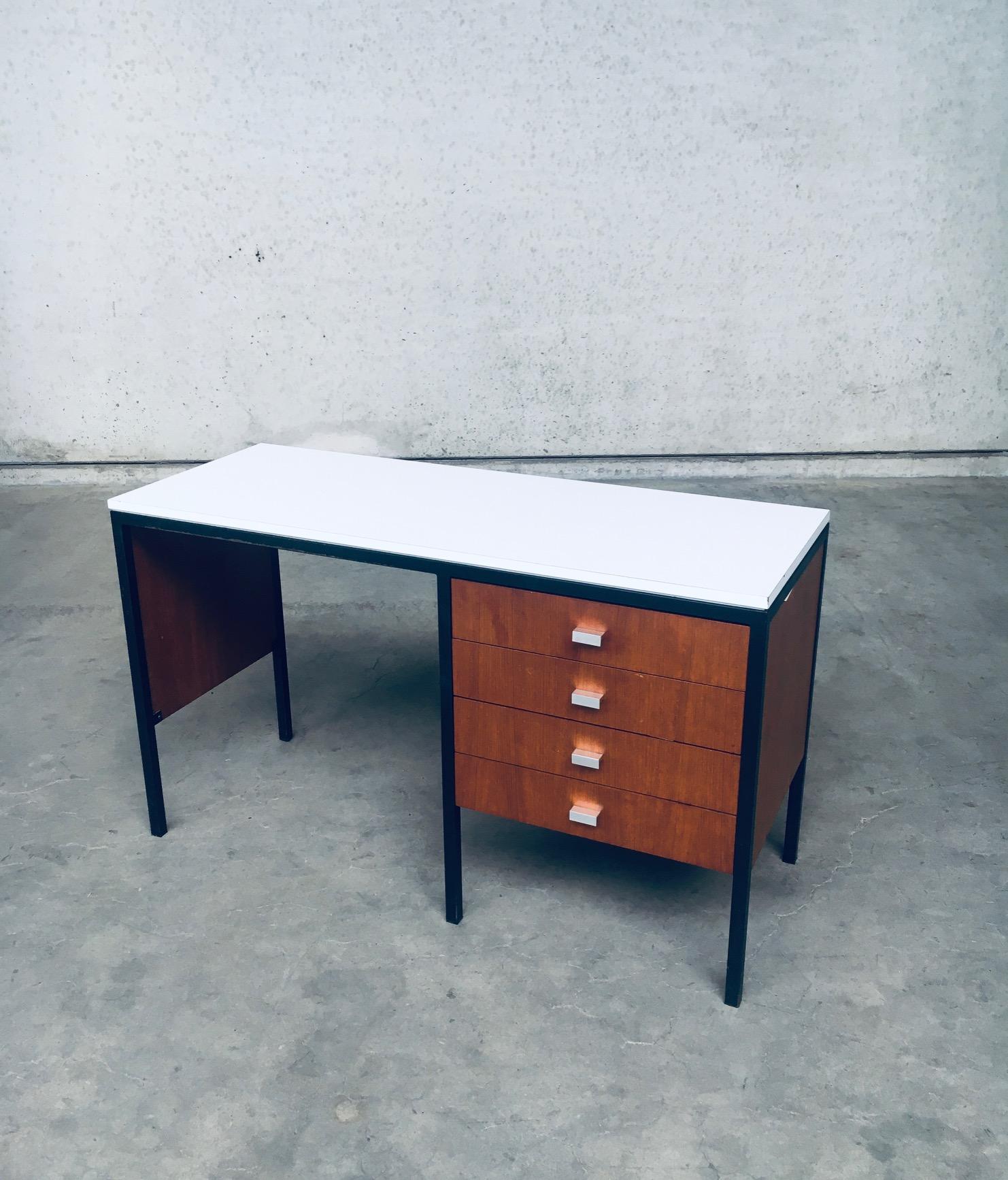Vintage Mid-Century Modern Dutch Design Desk, made in the Netherlands 1960's. In the style of Pierre Guariche designs. Laminated white top on black stained metal frame with wooden panels and wooden drawers. Architectural and minimalist design on