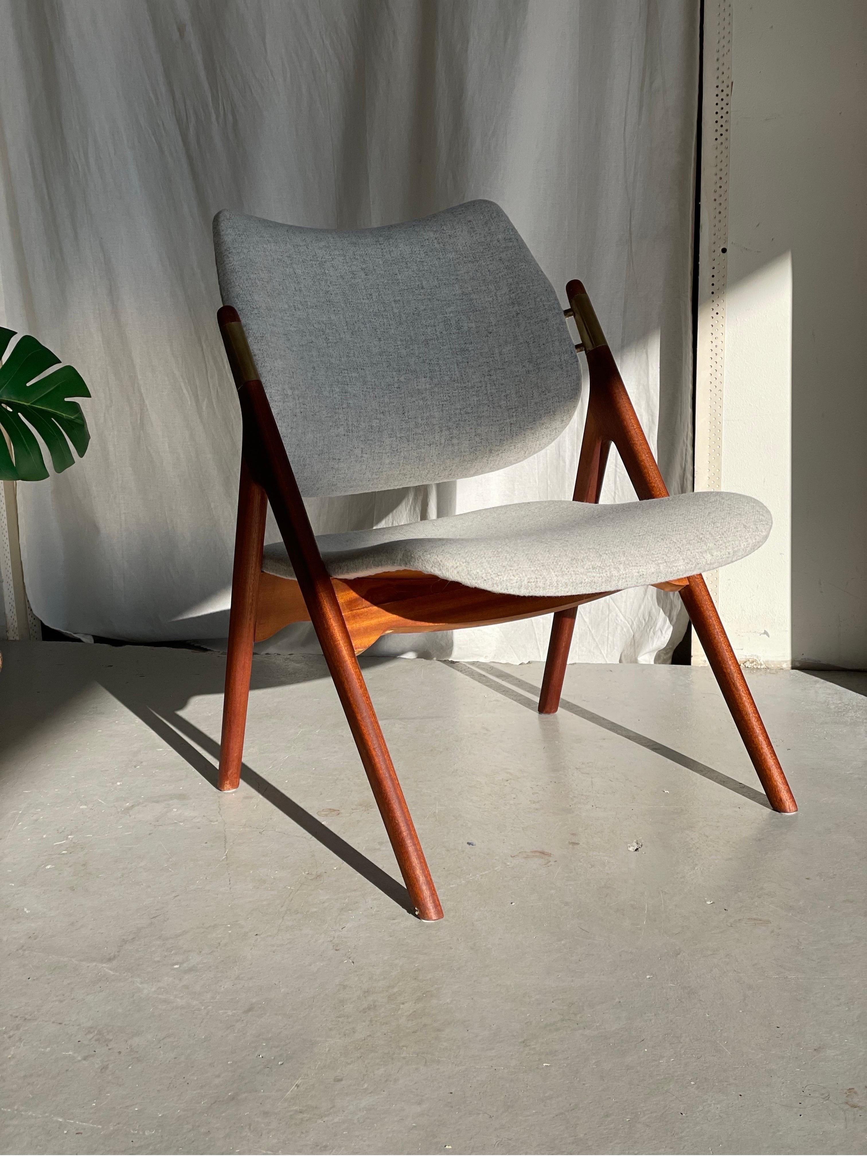 Scandinavian easy chair; model 46 designed by Olav Haug and produced at Elverum Møbel - og Trevarefabrikk, Norway
The chair is reupholstered in woolen fabric from Gudbrandsdalens Uldvarefabrikk, Norway.

