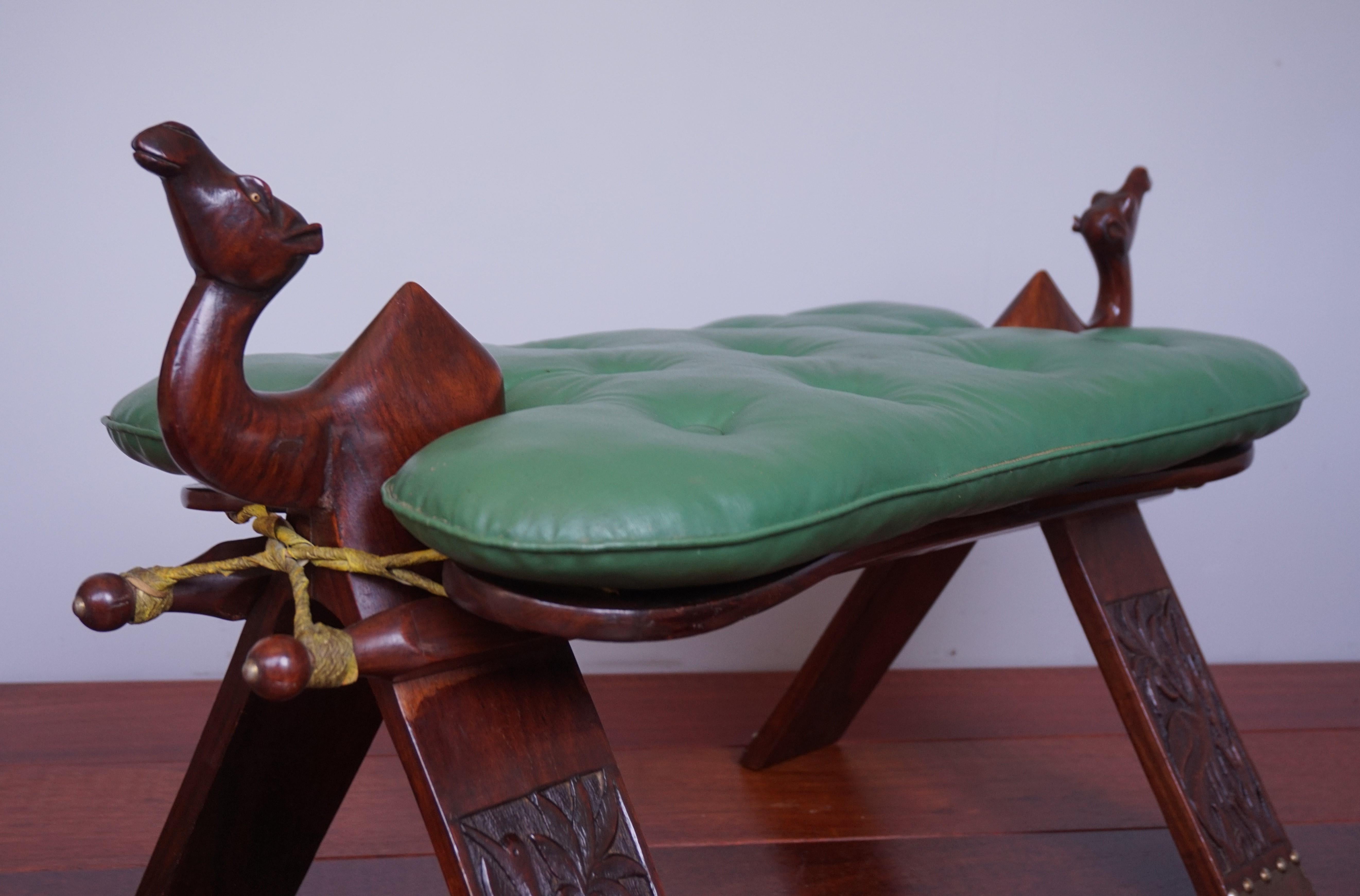 Egyptian Revival Midcentury Modern Era Tropical Hardwood & Skai Leather Stool W. Camel Sculptures For Sale