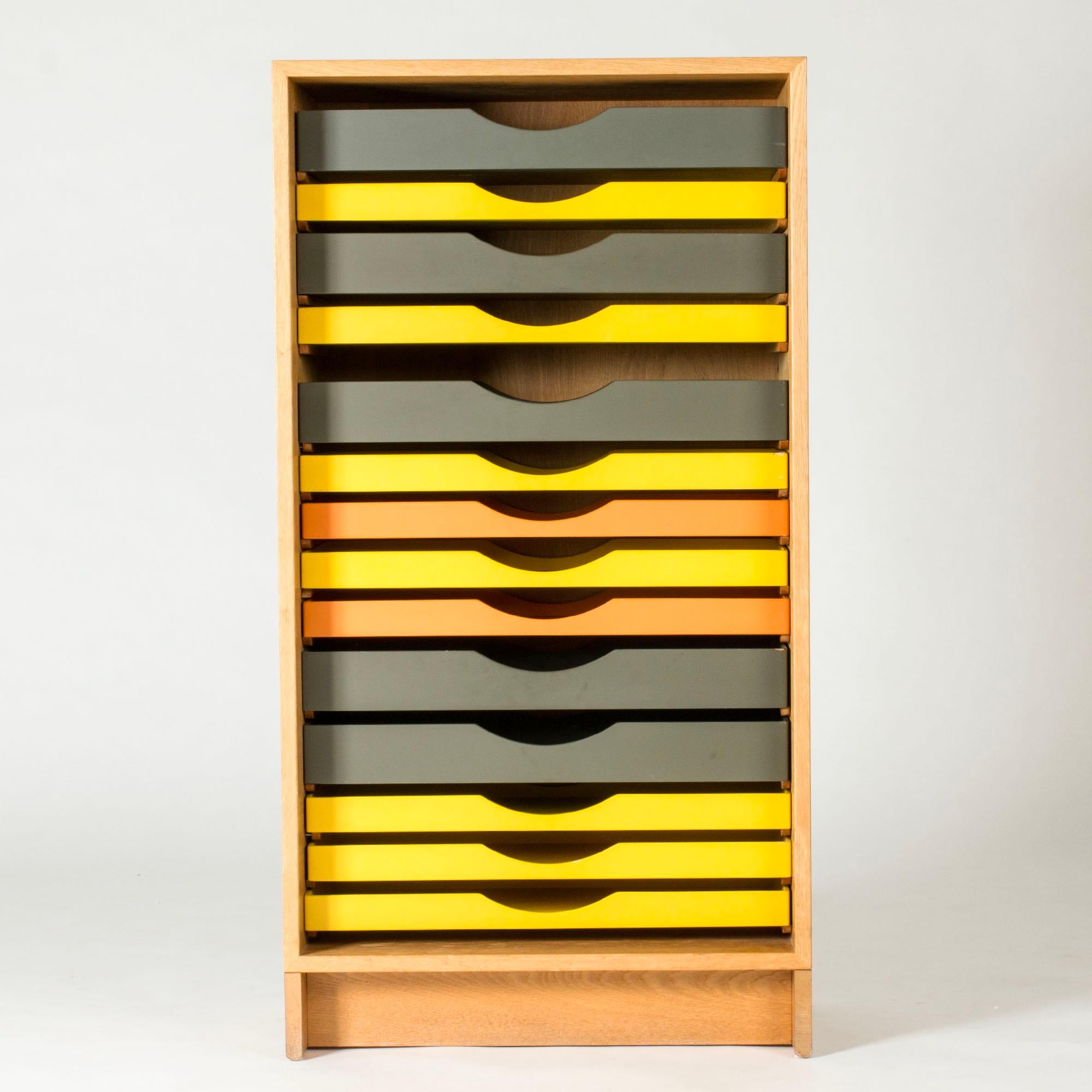 Amazing, colorful filing cabinet by Børge Mogensen, made from oak. Drawers with different heights, lacquered yellow, orange and grey. The drawers can be rearranged.