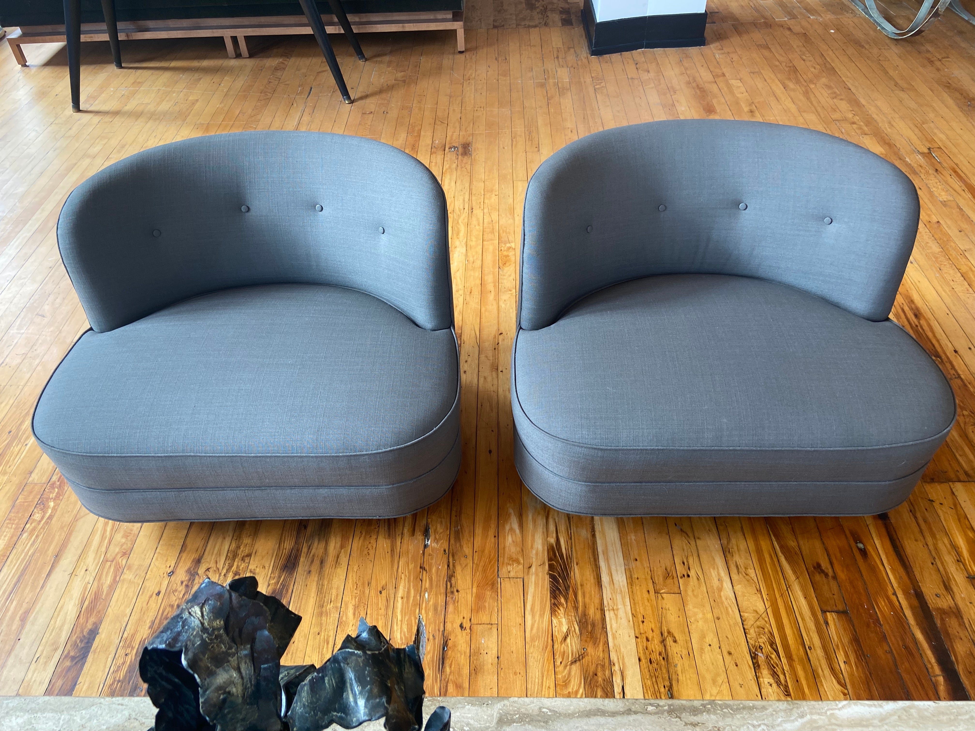 Pair of low lounge chairs with elegantly curved backs, circa mid-20th century designed by Gilbert Rhode. Rhode who is famously known for his modern design which he introduced during his time at Herman Miller Inc. 

This pair of slipper low lounge
