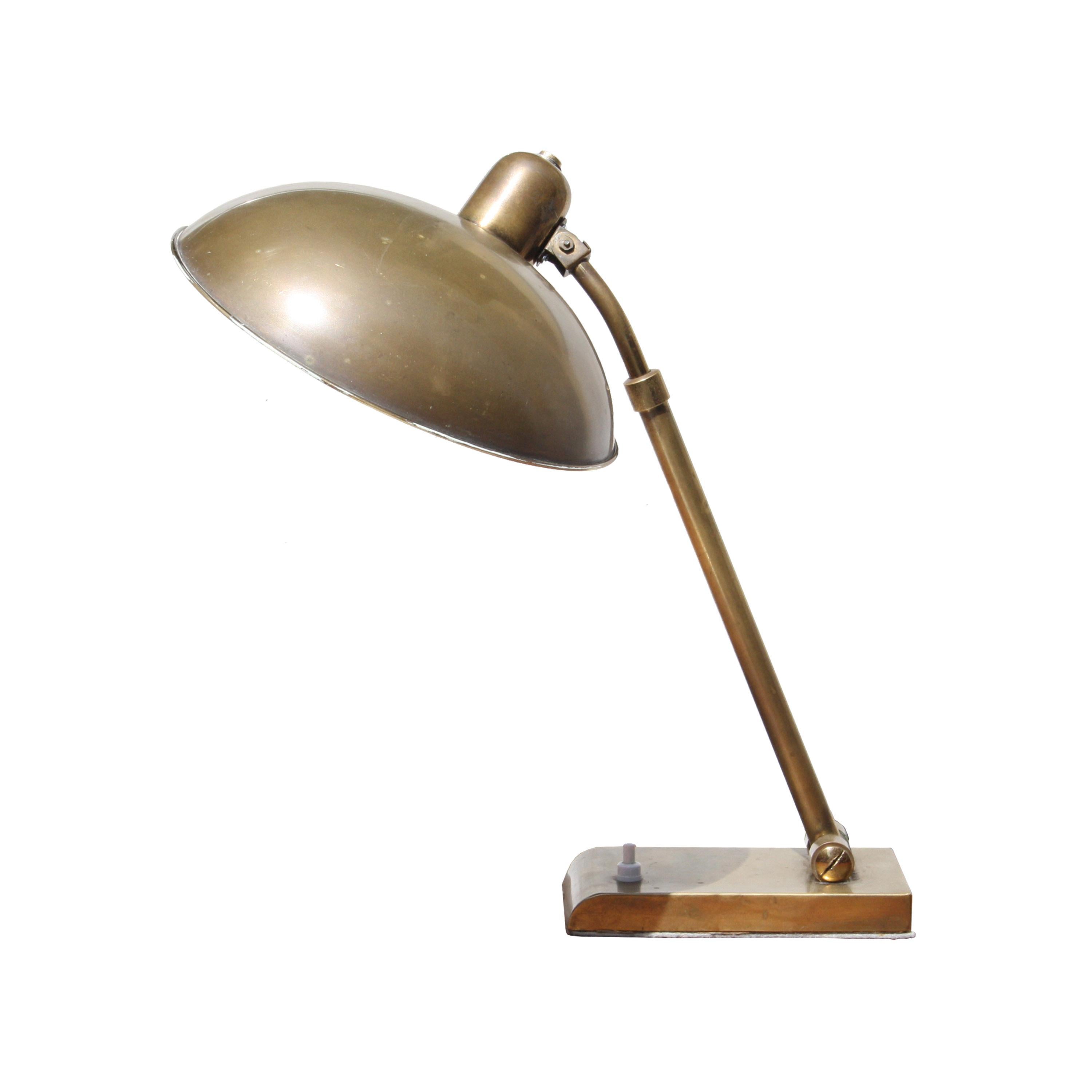 Desk lamp with structure and base in brass. Height and direction adjustable. 545.