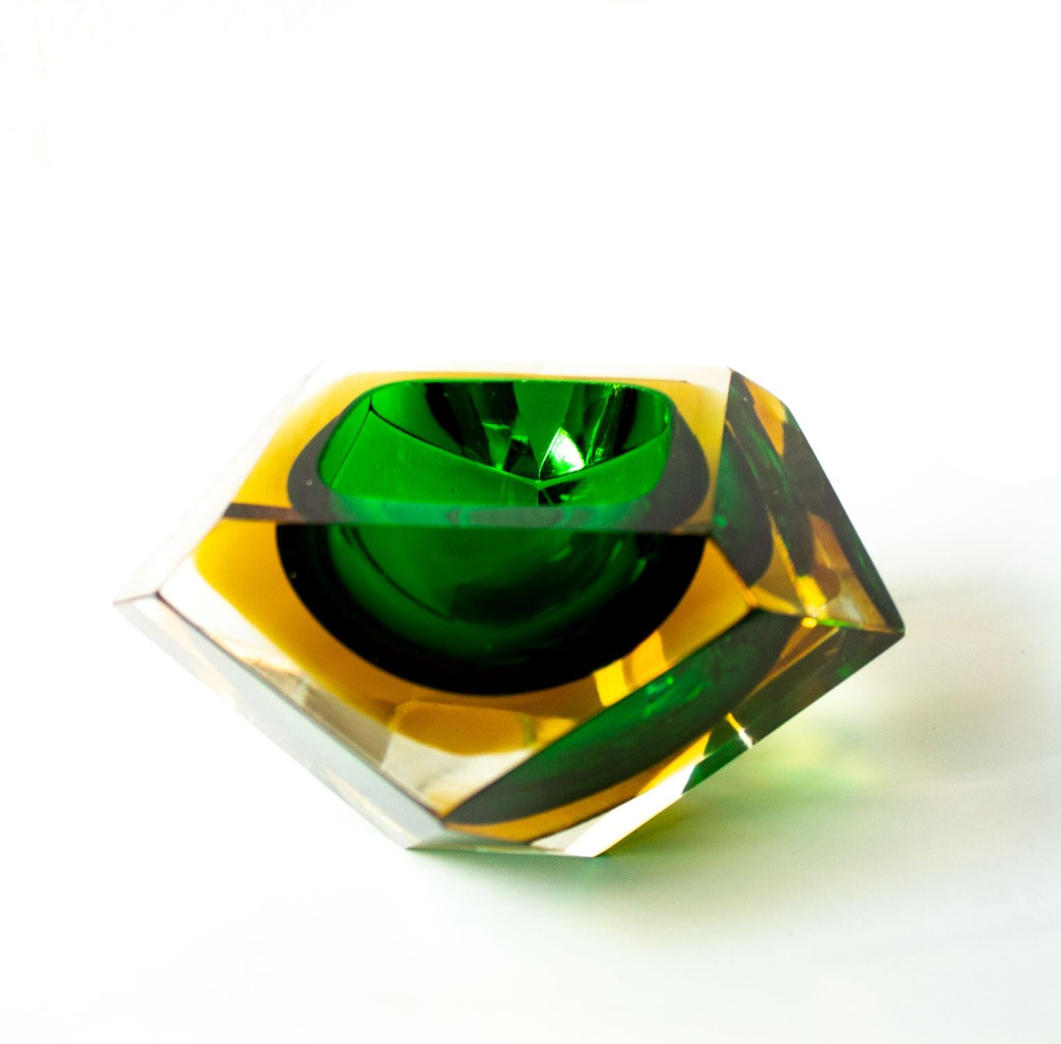Italian Mid-Century Modern green and yellow Sommerso Murano glass bowl attributed to Flavio Poli. 
Designed in a diamond shaped 12 faceted sides in hues of yellow and green. Cool deco item that can be used as a serve ware, ashtray or jewelry bowl.
