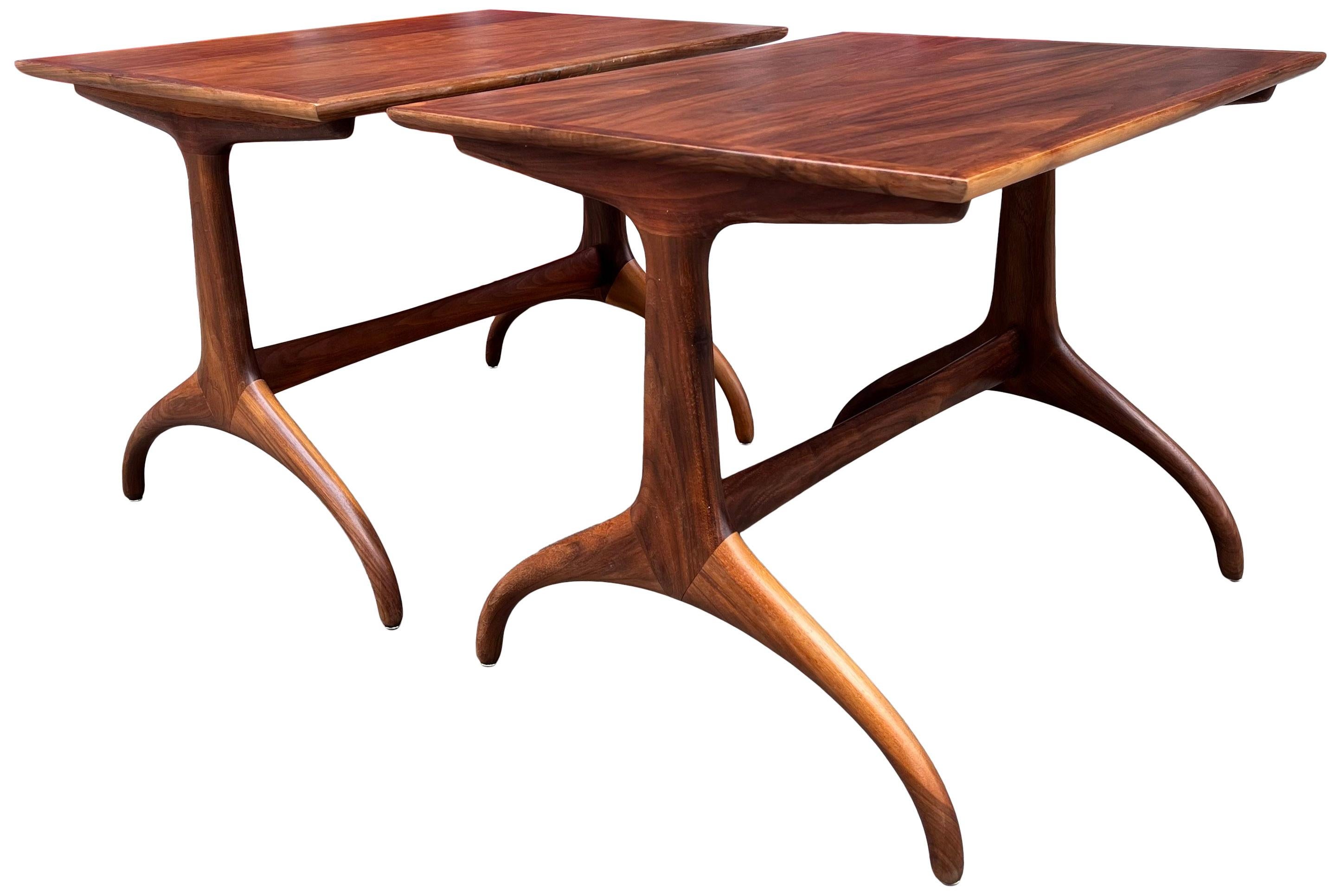 Gorgeous and classic mid-century wishbone style tables by Henredon furniture produced in the late 40's early 50's. Comprised on walnut and in wonderful condition. The table proportions make it versatile as it can be used as bedside table, end