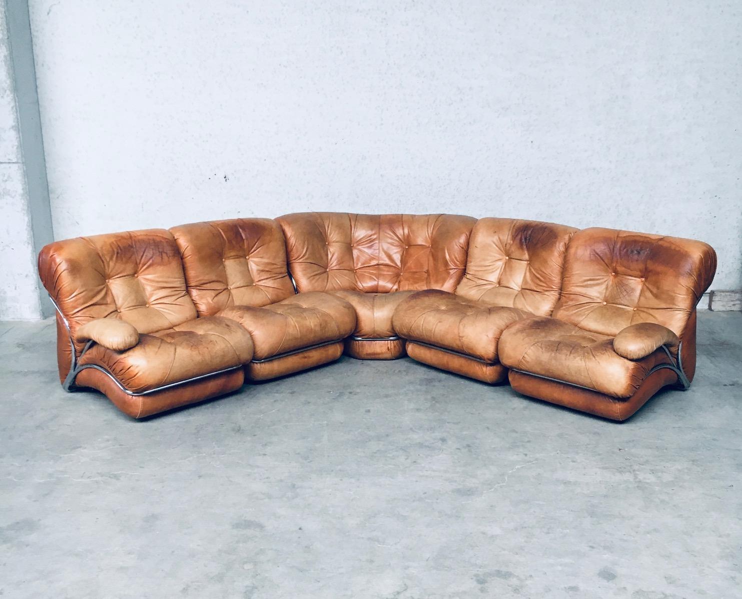 Vintage Midcentury Modern Italian Design 'COROLLA' Leather Sectional Sofa by I.P.E. Italy 1970's. Marked on the bottom. Cognac leather on chrome metal frame with detachable arm rests on 2 sofa parts. 5 sectional parts; 4 chairs and 1 corner chair.