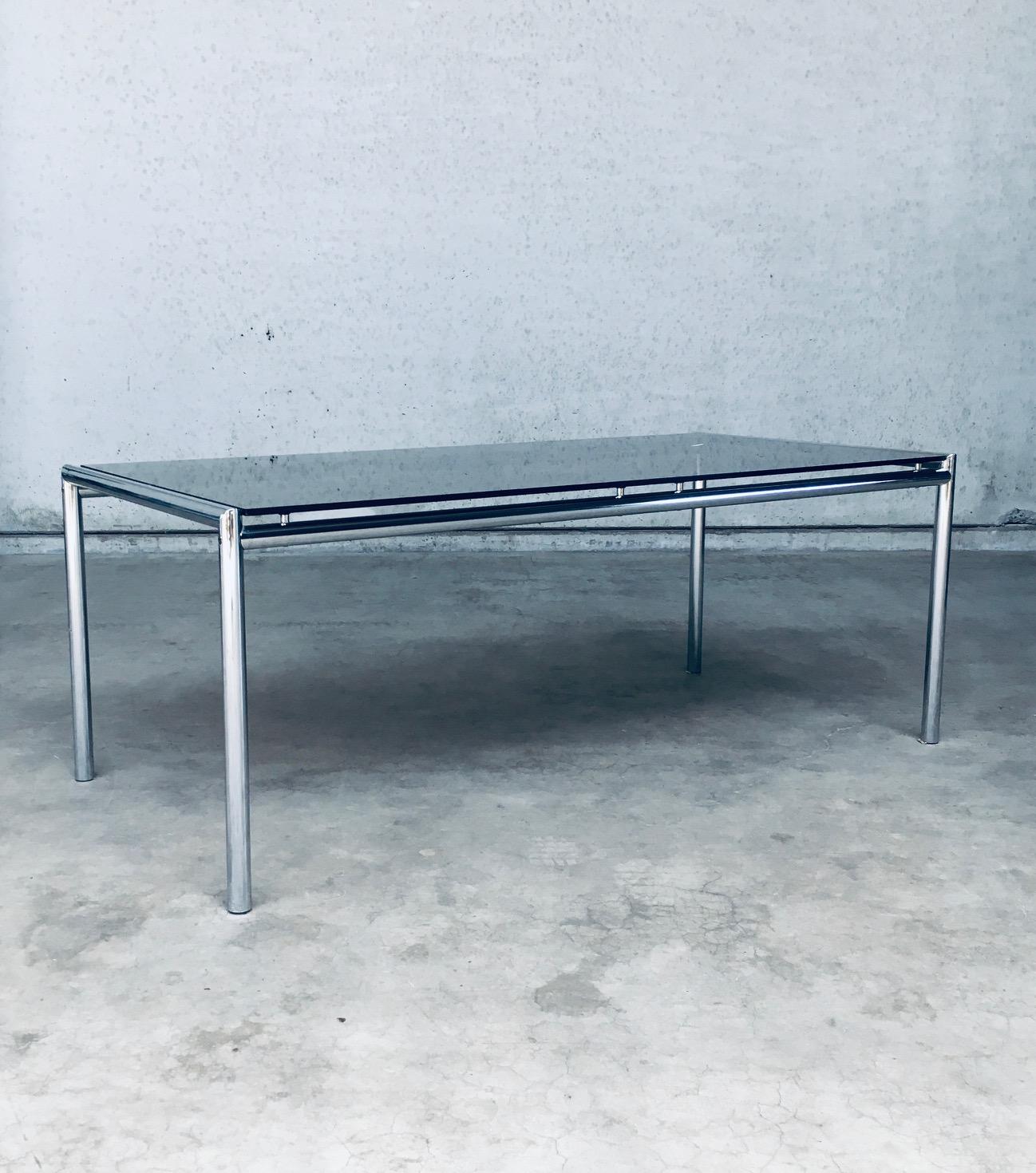 Vintage Midcentury Modern Italian Design Tubular Chrome & Smoke Glass Dining Table. Made in Italy, 1970's. Tubular steel frame with chrome finish and smoked glass table top. This table will easily seat 6 to 8. We have the matching dining chairs for