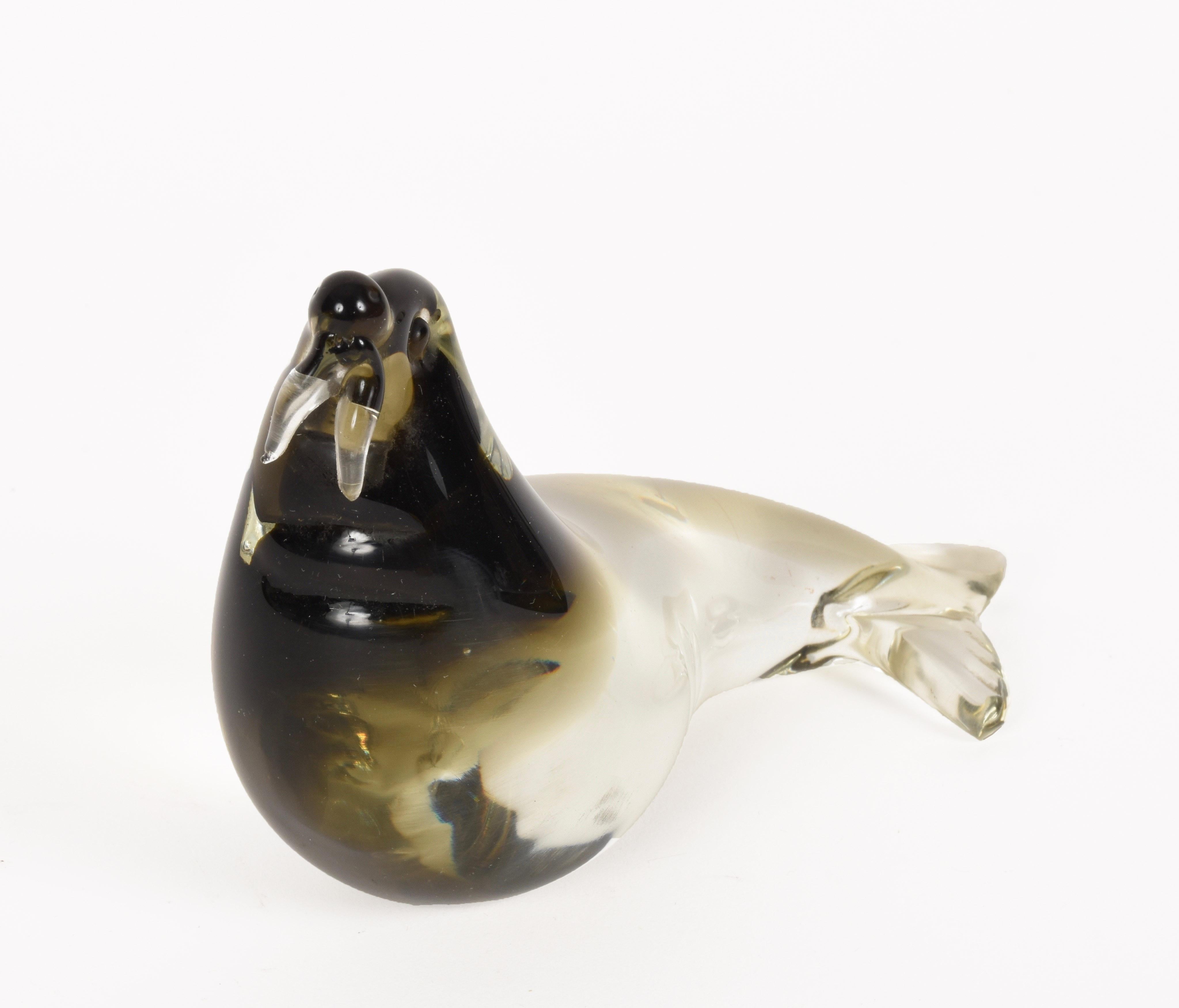Amazing Mid-Century Modern Italian walrus black, brown and crystal Murano glass sculpture. 

This incredible item was produced in Italy during the 1960s and it is attributed to Archimede Seguso. 

This piece is wonderful as the colors follow the