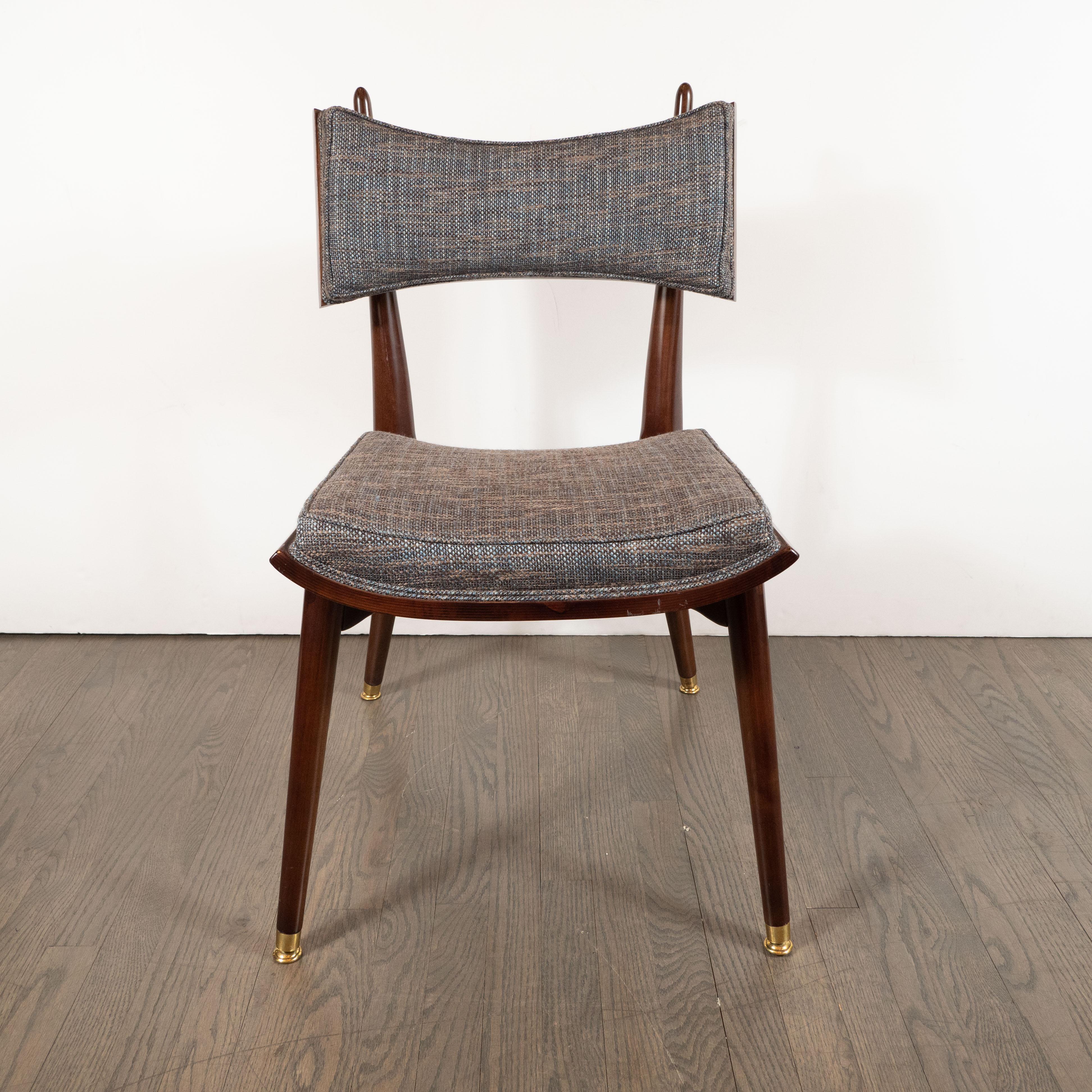This rare and dramatic side chair was realized by the esteemed Mid-Century Modern Designer Harold Schwartz for the Romweber Furniture Co. in America, circa 1960. Handmade in handrubbed walnut with brass details throughout, this chair offers