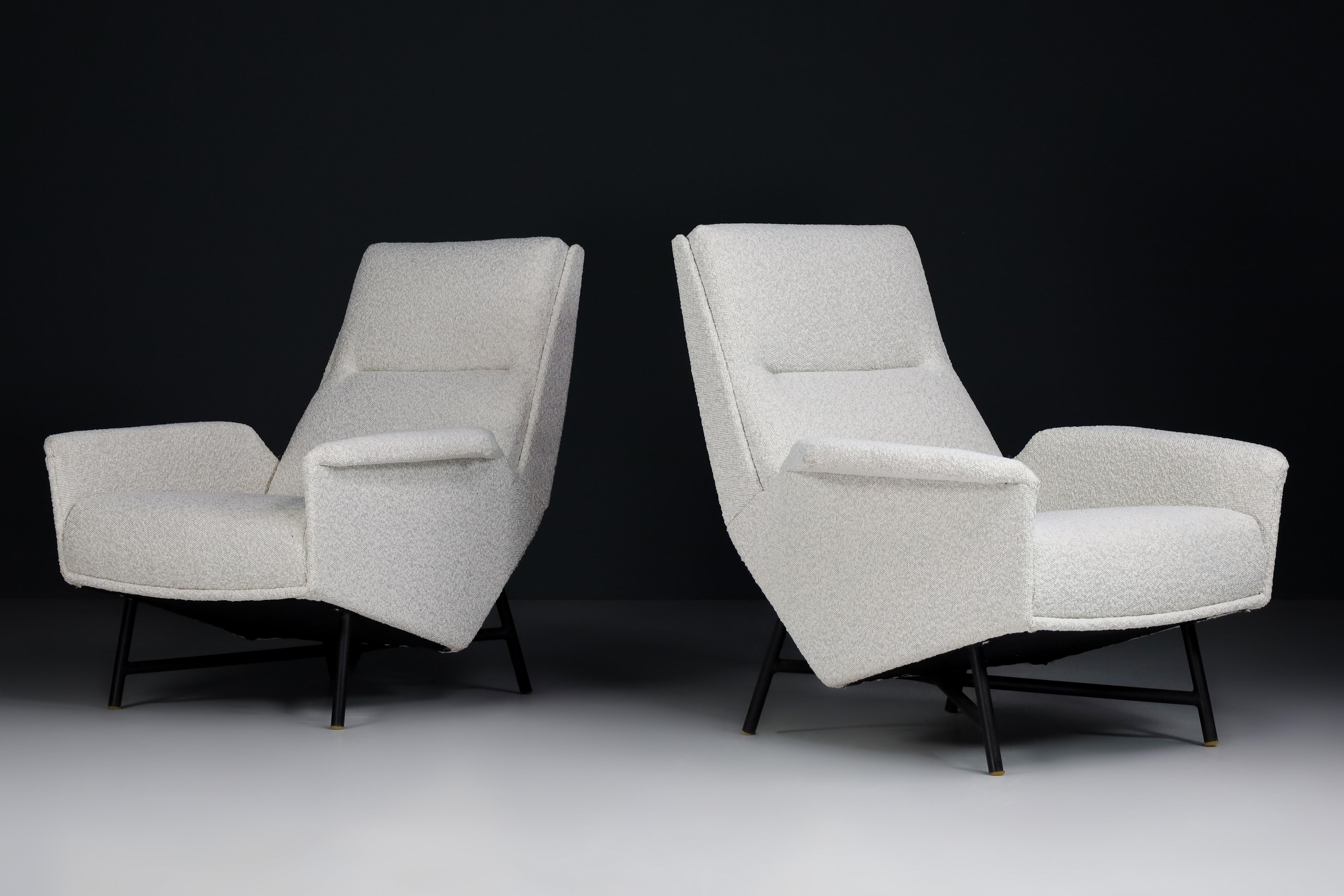 Mid-Century Modern lounge chairs designed and edited by Guy Besnard in re-upholstered Bouclé fabric, France, 1959. 

These lounge chairs would be an eye-catching complement to any interior, such as the living room, family room, screening room or