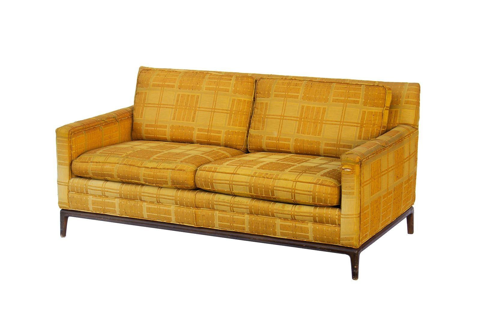 USA, 1960s
Classic and comfortable midcentury modern loveseat with a sculpted walnut base. This sofa has such excellent scale and looks great from every angle. The walnut base has curves in all the right places. A very comfortable design, full scale