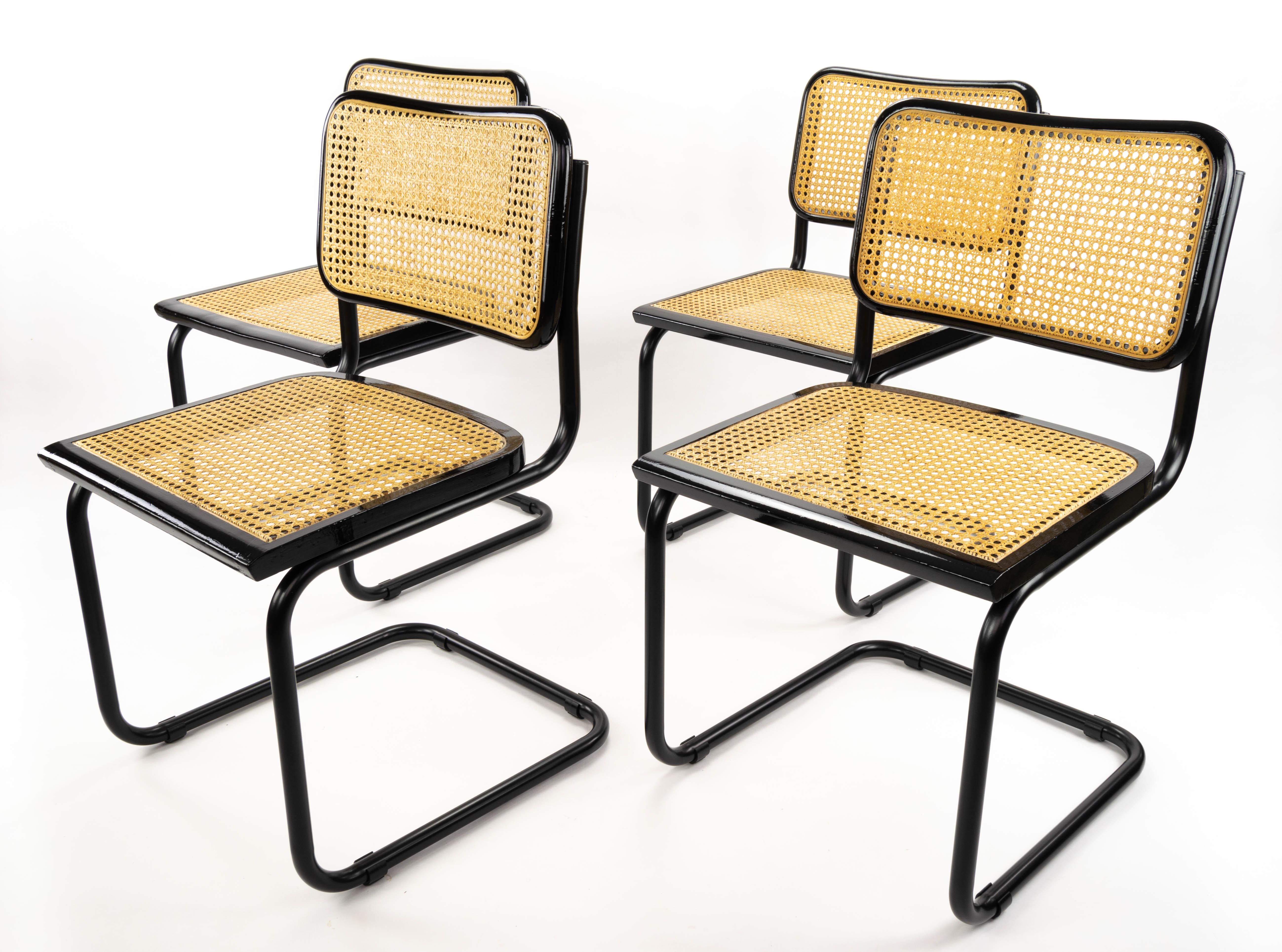 Set of four Cesca chairs, model B32. Tubular structure in black lacquered steel in excellent condition. Beech wood frames lacquered in black and Viennese natural grid. Grids of the four seats have been put new.
Measurements:
Total height 83.5
