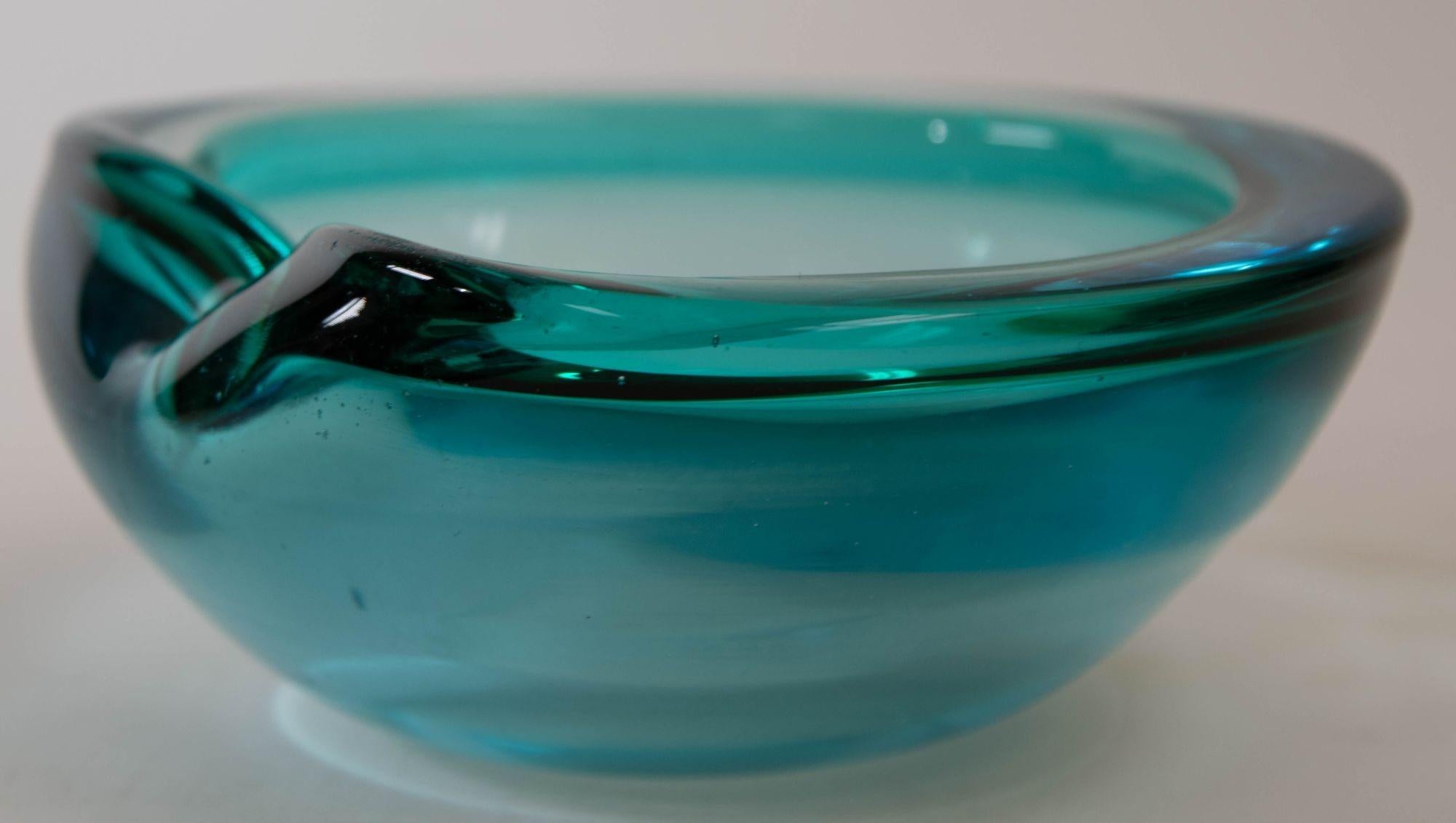 Vintage Mid-Century Modern blue glass Murano decorative bowl ashtray blue, circa 1970s.
Mid-Century Modern decorative glass bowl, ash tray.
This vintage Murano glass bowl, ashtray, ash tray was handcrafted in the 1970s in Murano, Italy- the island