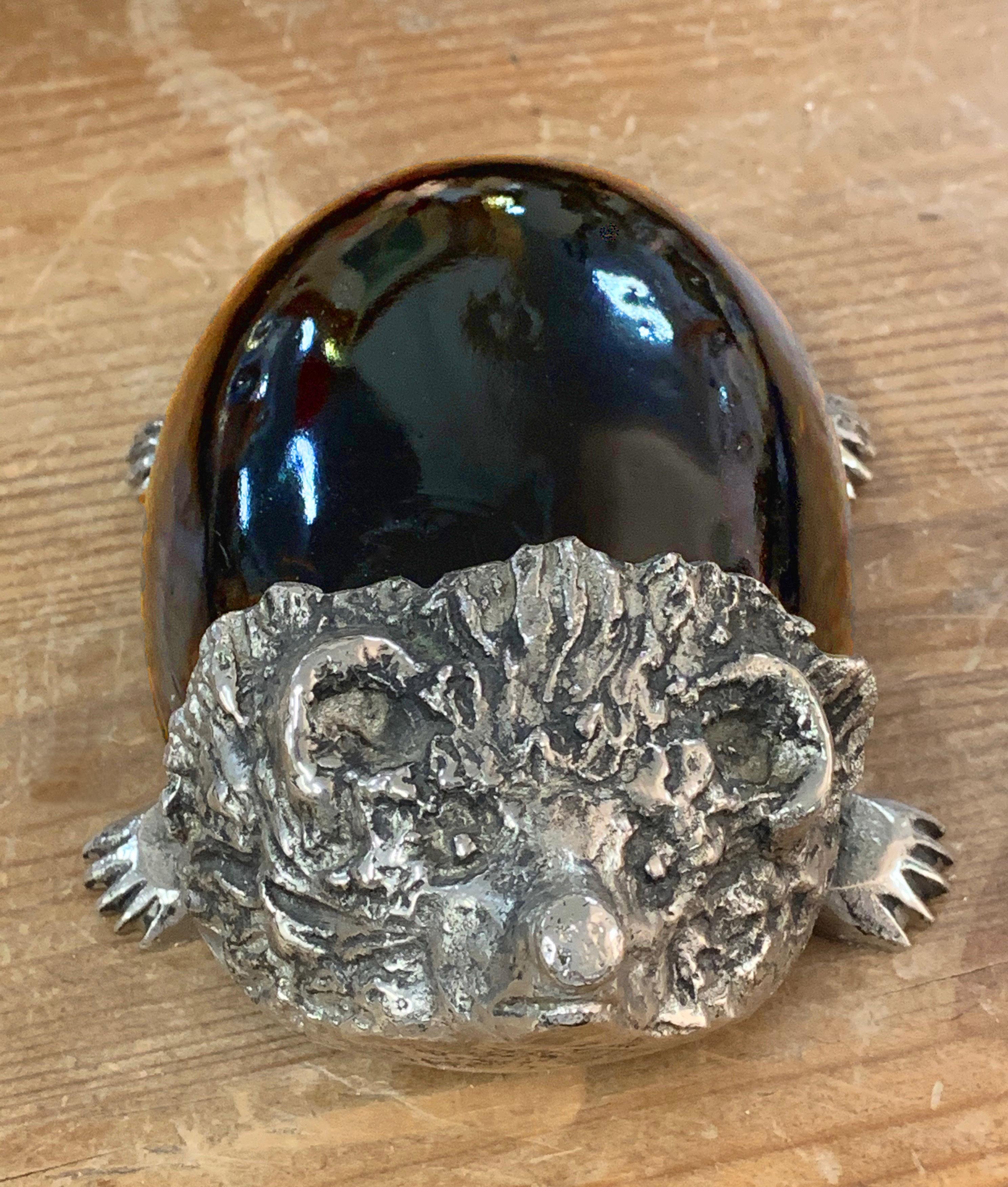 A beautiful Hedgehog sculpture in Murano glass and silver plate. This item was made in Italy in the 1970s.

The body of the hedgehog is in solid Murano glass with an amber-like colour, while the legs and the head are in silver plate.

This piece
