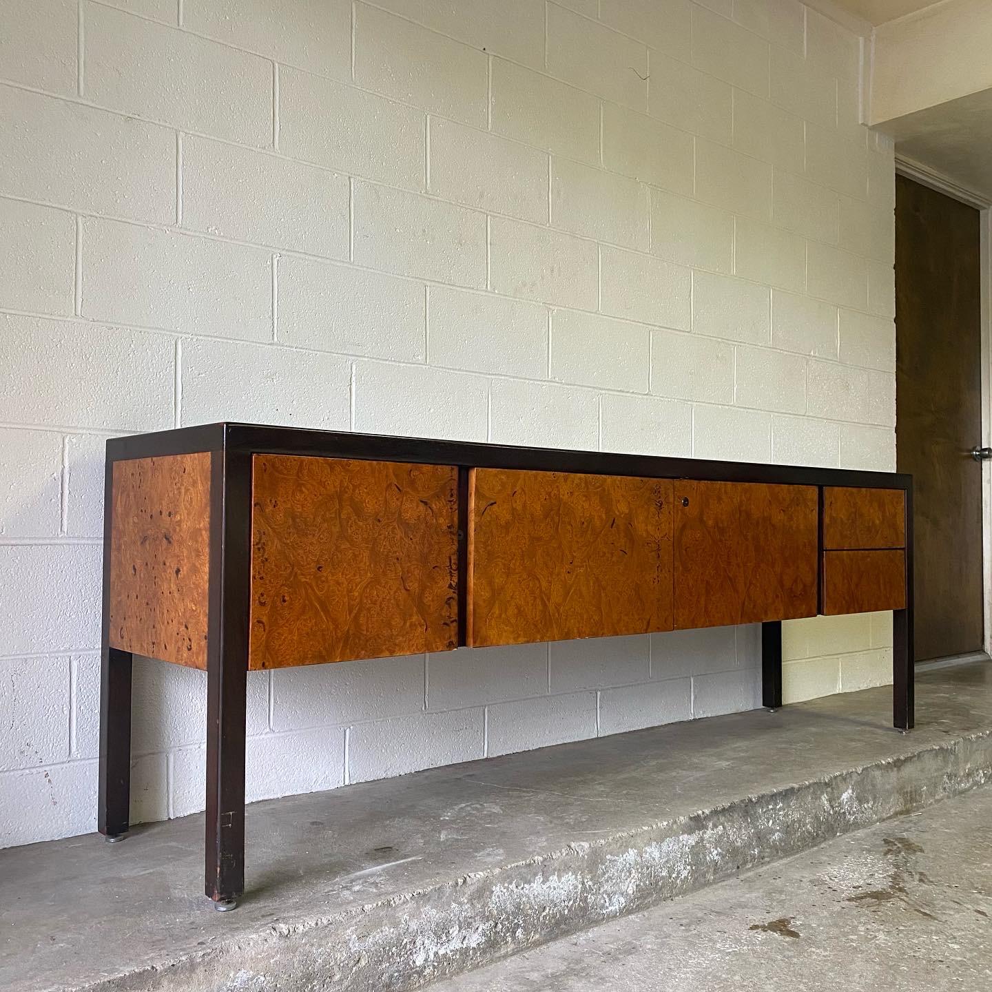 This is an incredibly high quality olive burl credenza with leather top and mahogany frame and legs, ca. 1970’s. The extent gone to make this piece luxurious shows how high end it is. It’s stunning all the way around with burl on both sides. There’s