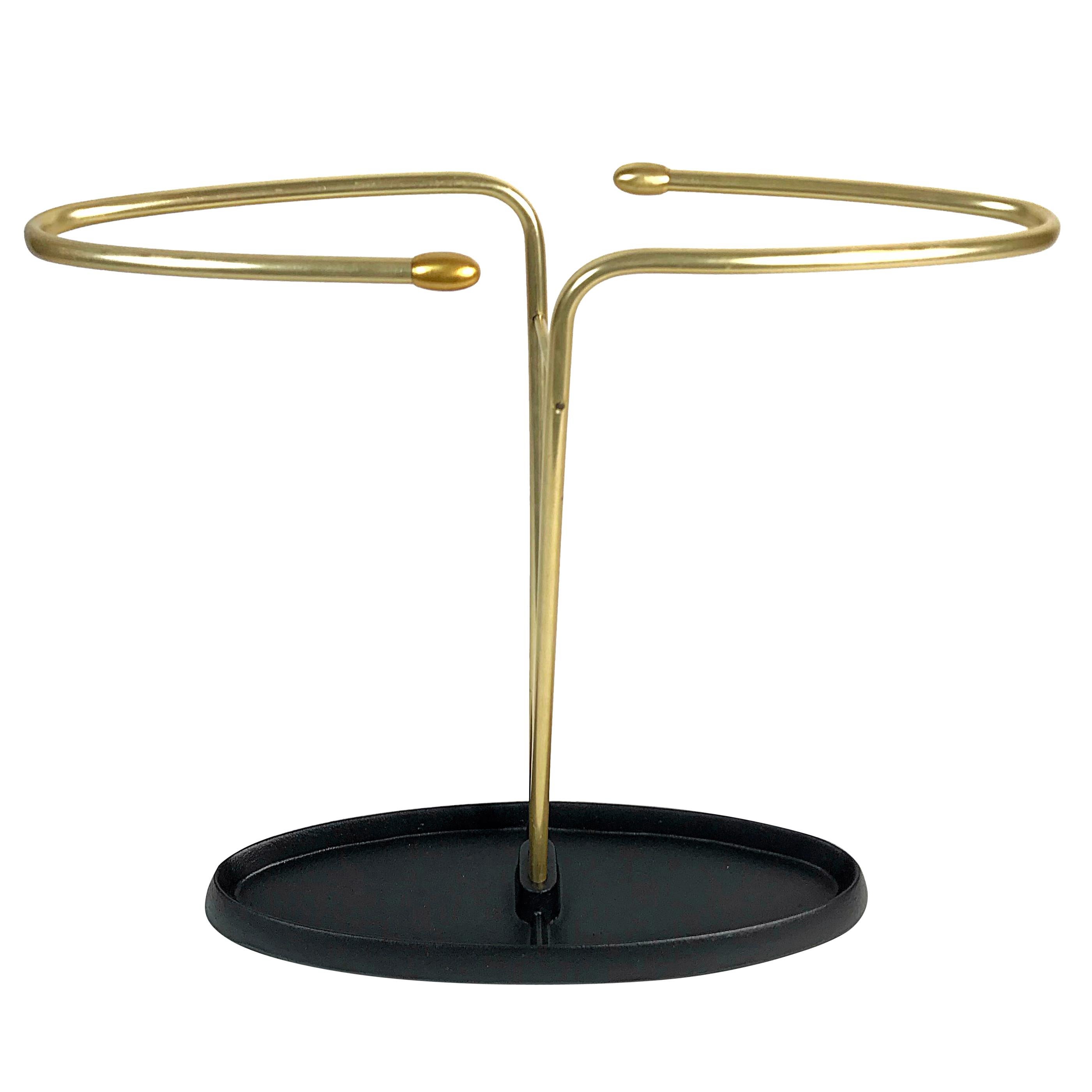 Simple and elegant midcentury umbrella stand in style of Auböck, manufactured in the 1950s, Austria. Black lacquered iron and brass.