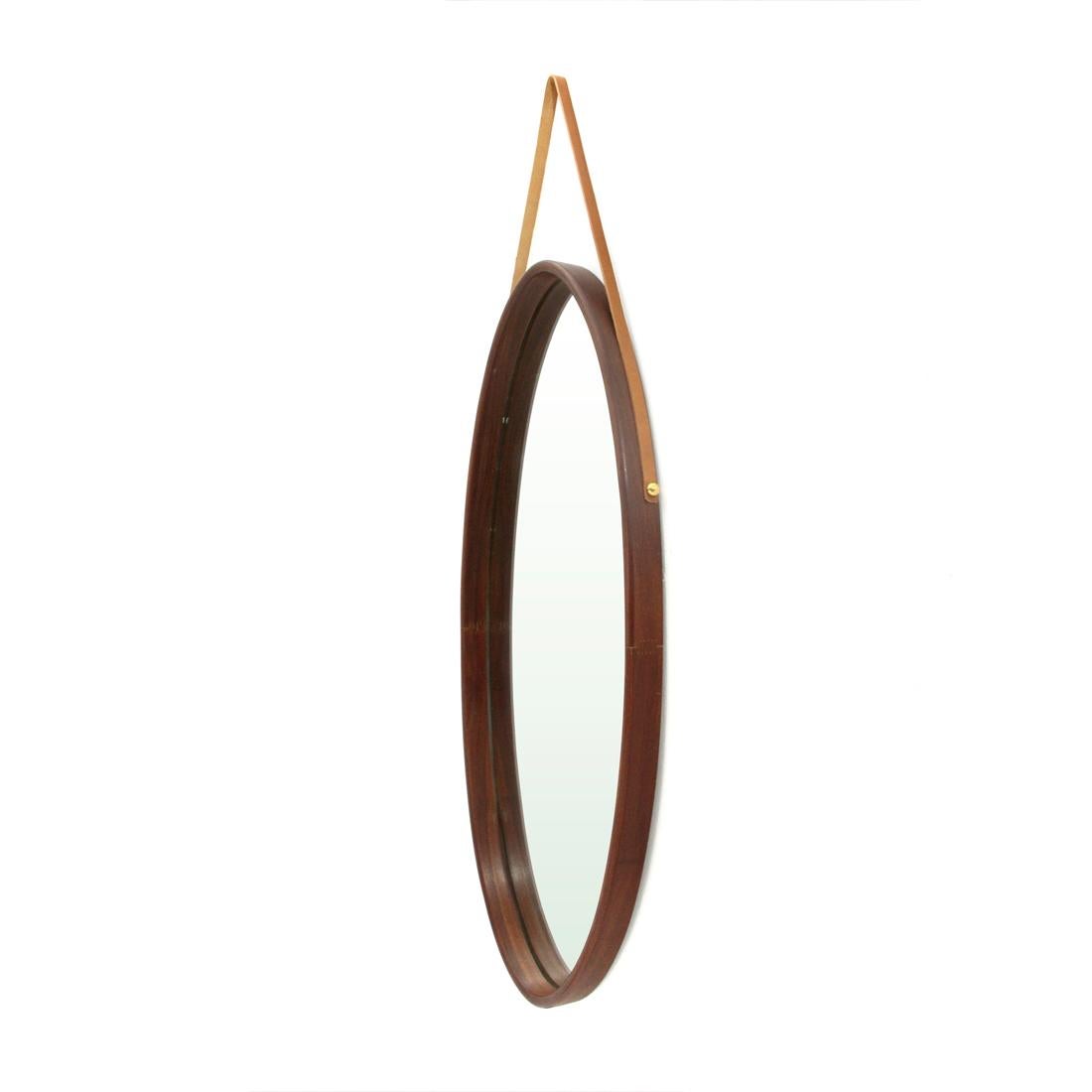 Italian manufacture mirror produced in the 1960s.
Curved wood frame.
Leather lace.
Good condition, some signs due to normal use over time, small break in the frame.

Dimensions: Length 32 cm, height 103 cm, depth 4.5 cm.