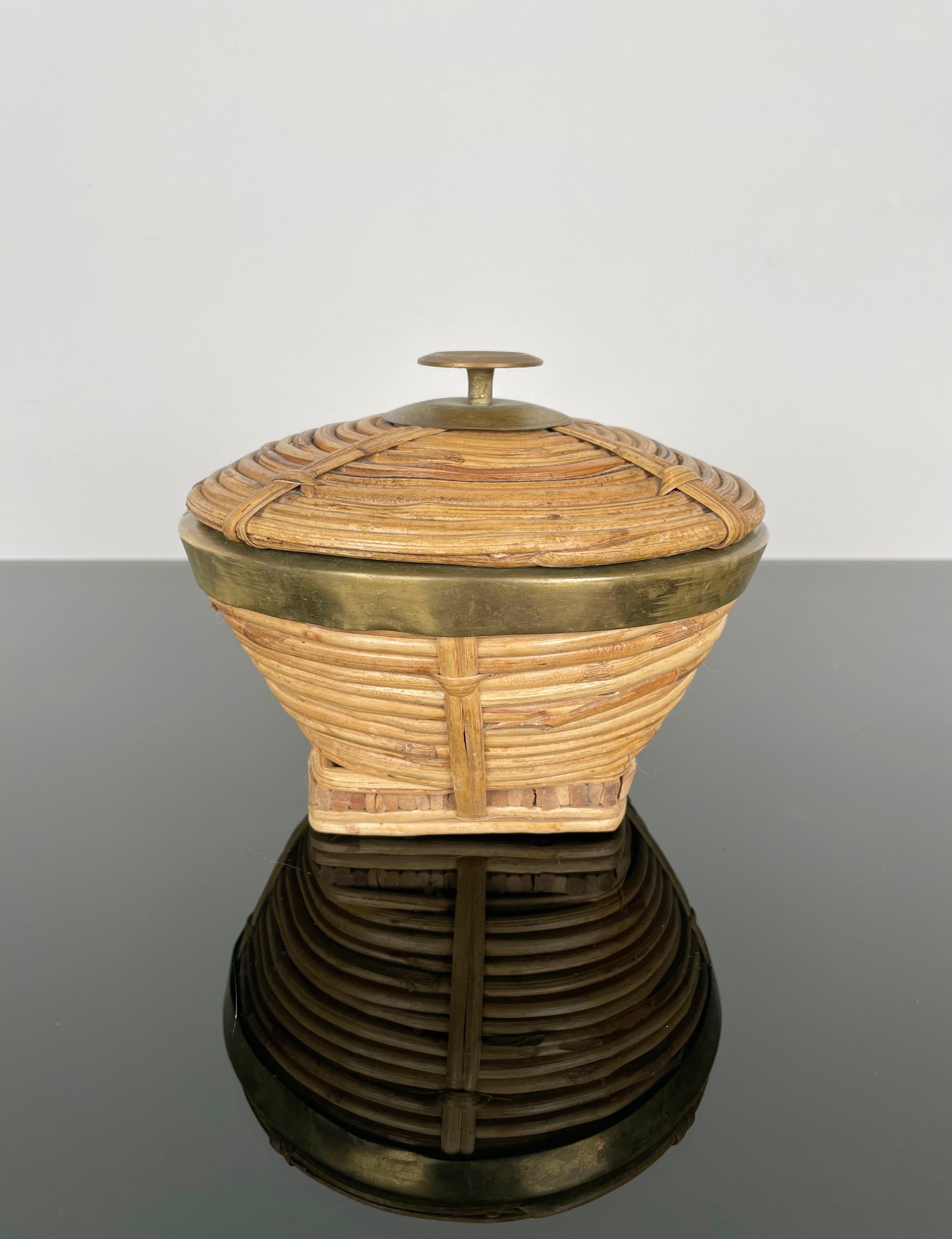 1960s rattan decorative box or bowl with cover featuring brass details made in Italy.