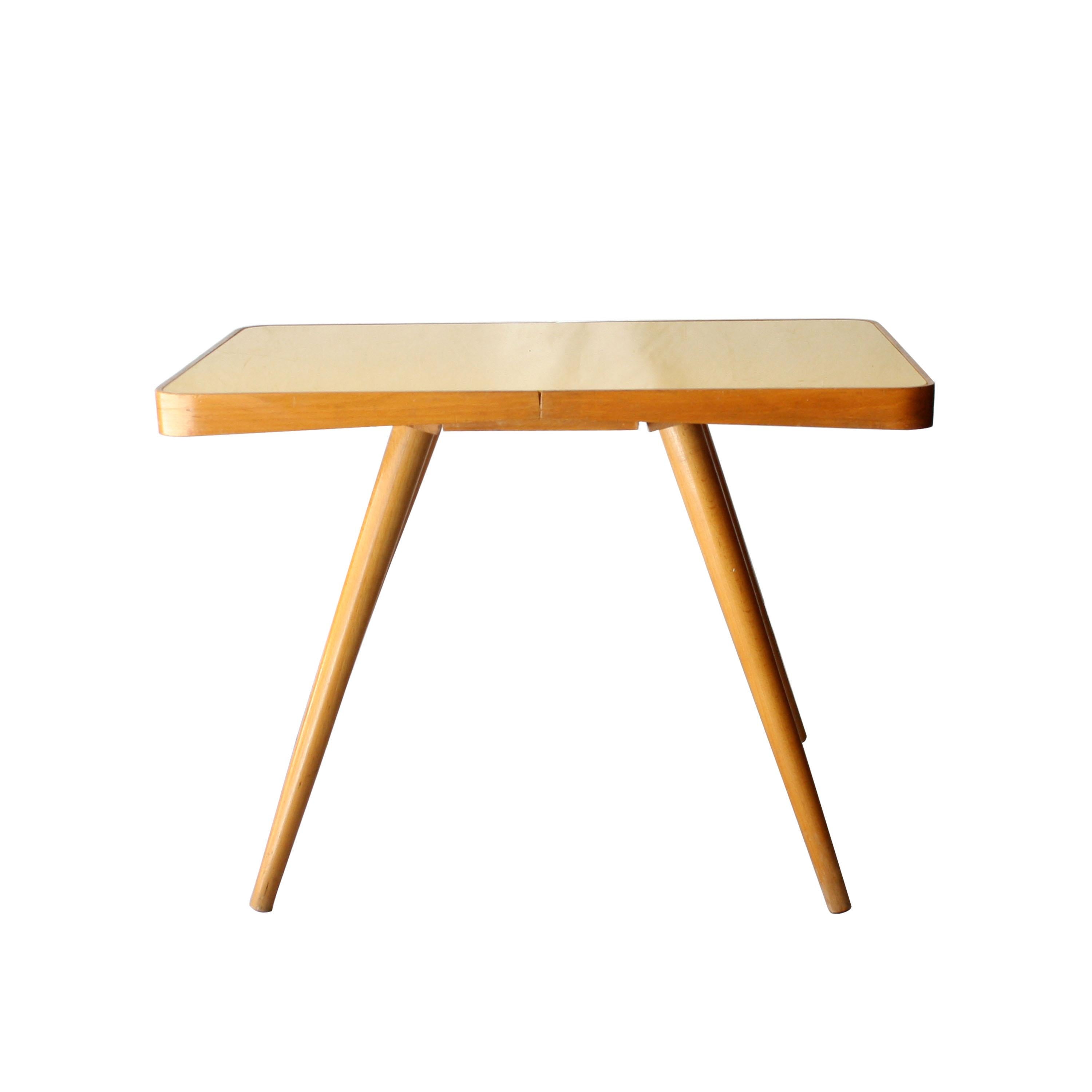 Oak structure table with conical legs and yellow glass top.