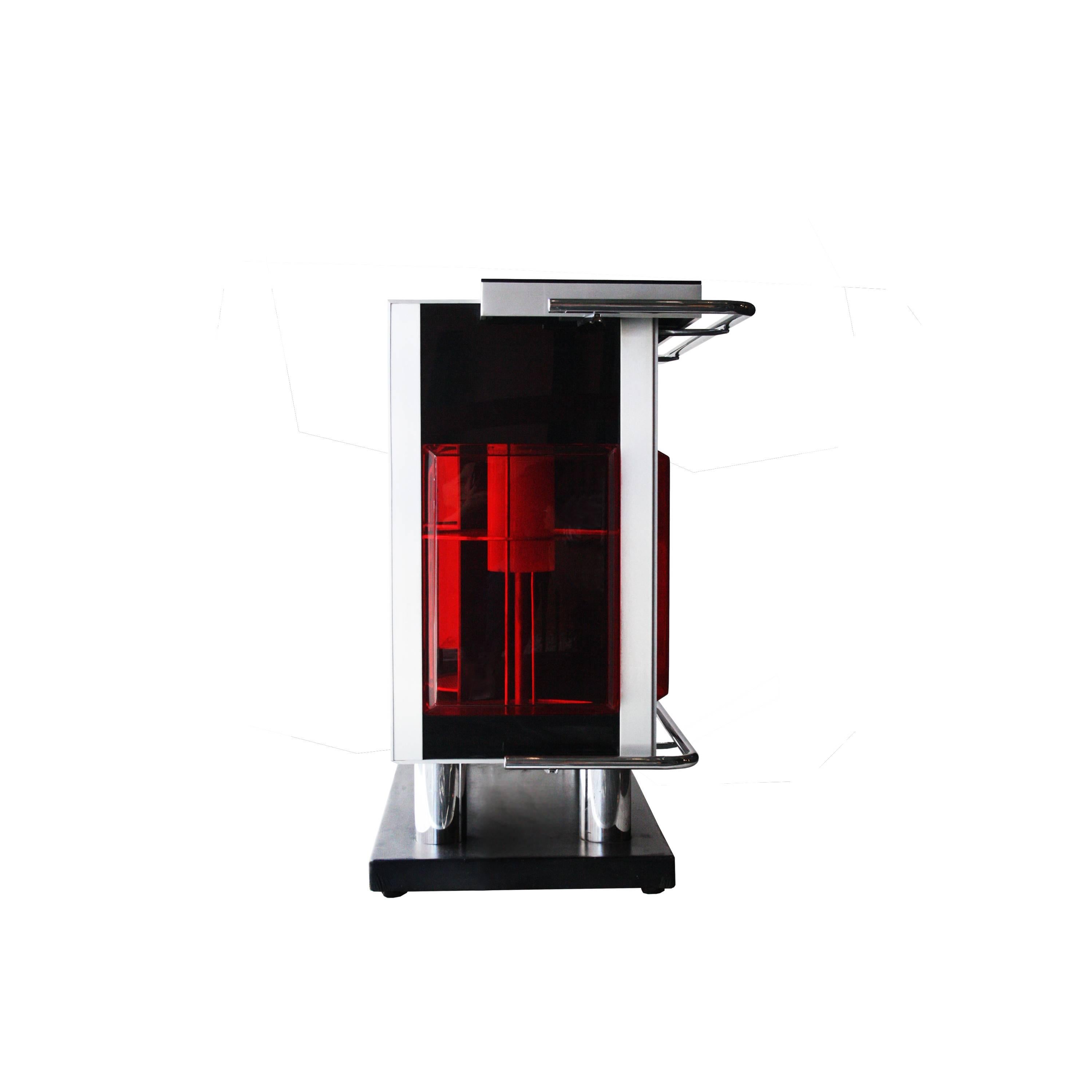 Bar with wooden structure, red perplex screen and details in chromed steel. Interior with backlit rotating bottle rack.