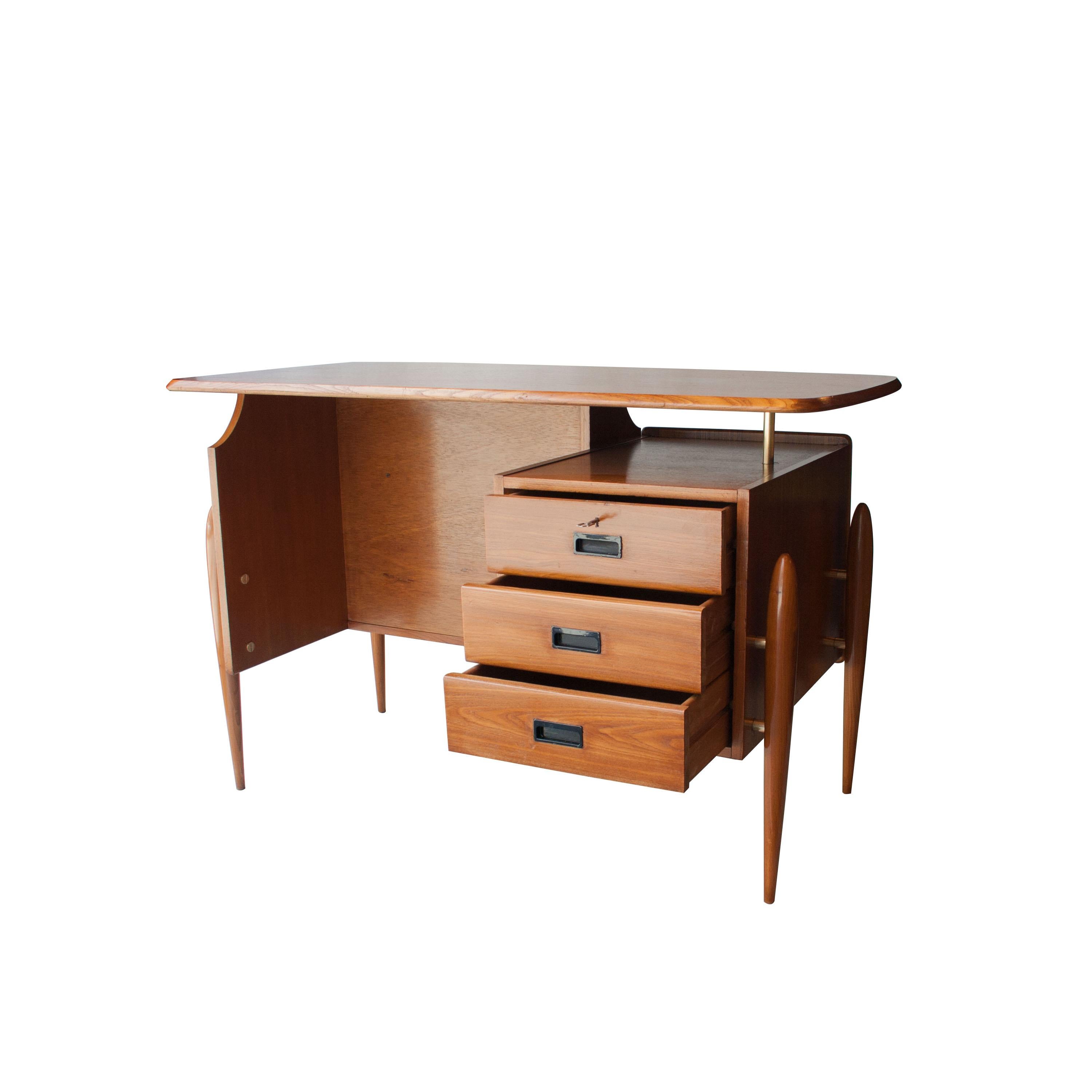 Scandinavian handcrafted desk. Made in solid teak wood carved by hand whit details in brass. Filing cabinet with three drawers.