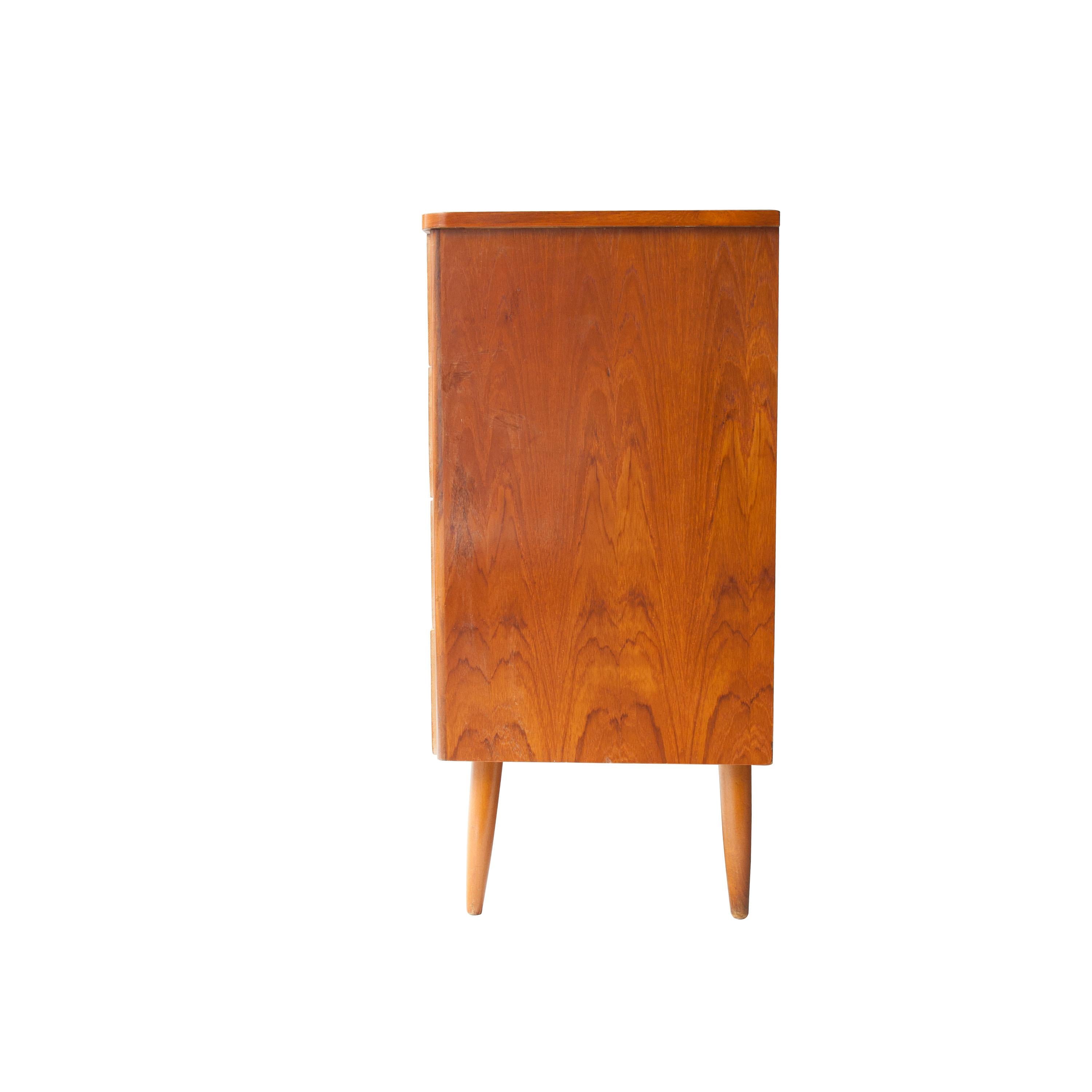 Swedish sideboard with teak structure, four drawers and conical legs.
