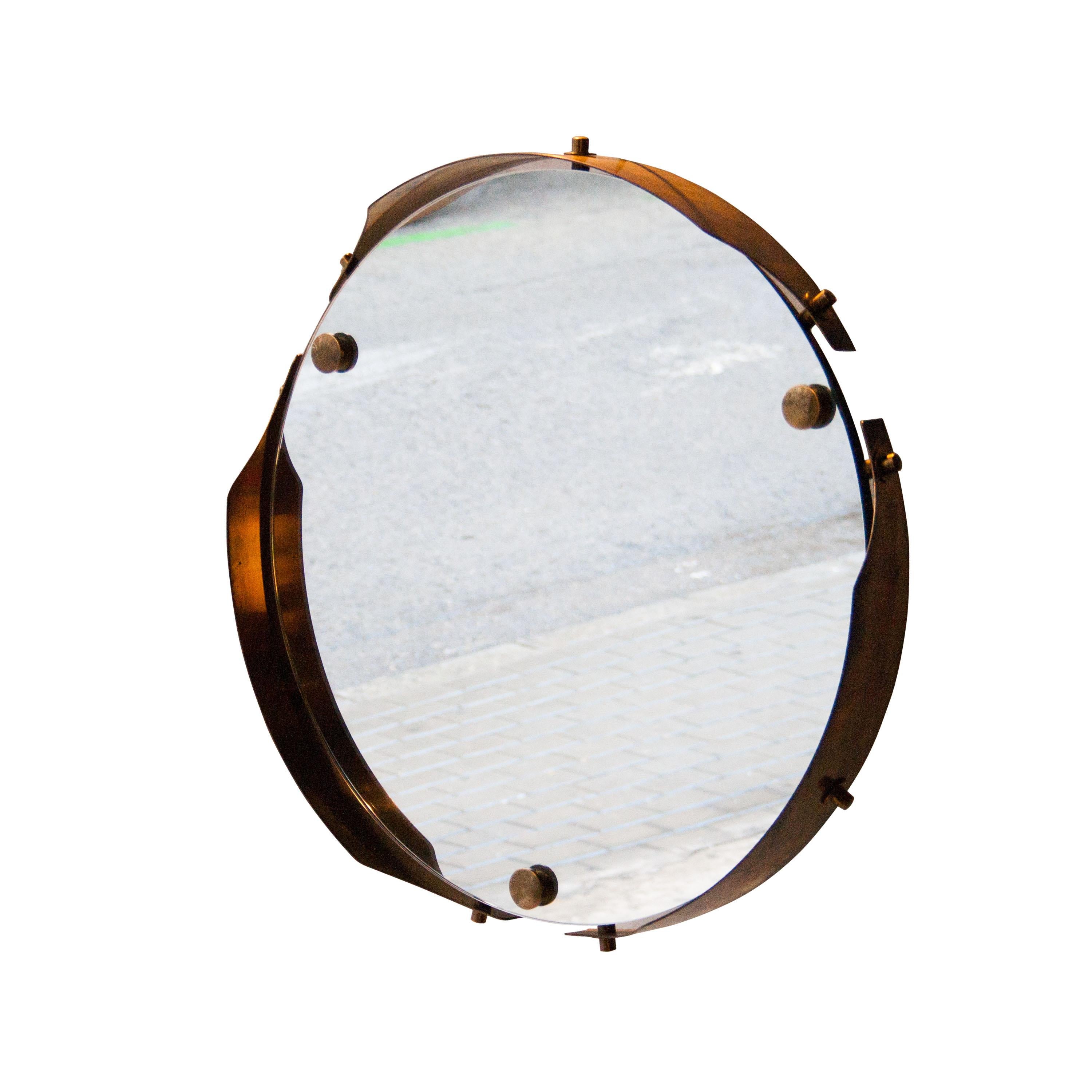 Midcentury Italian round mirror with brass structure.
