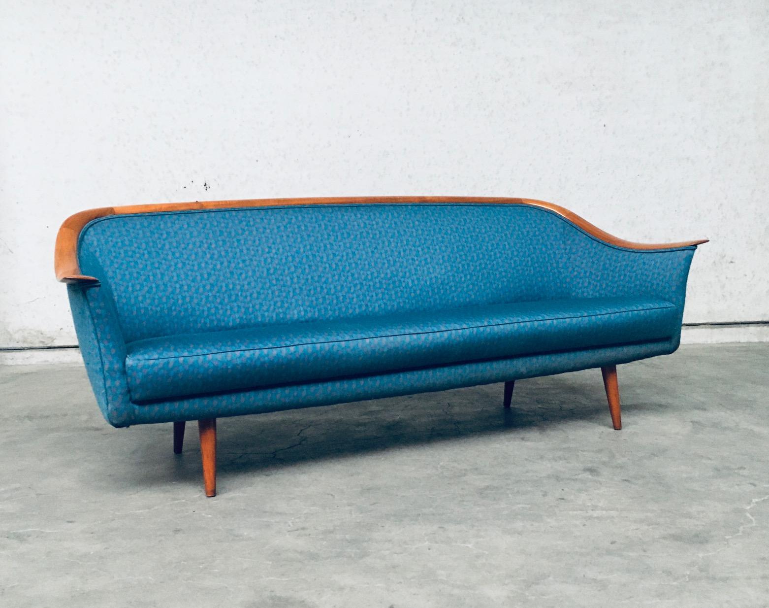 Vintage Mid-Century Modern scandinavian design 3 seat sofa by Dux, made in Denmark 1960's. Well designed and formed three seater sofa. Teak wood formed and bend arm and back top rest with a more recent 1980's blue fabric on 4 legs. This 3 seat sofa