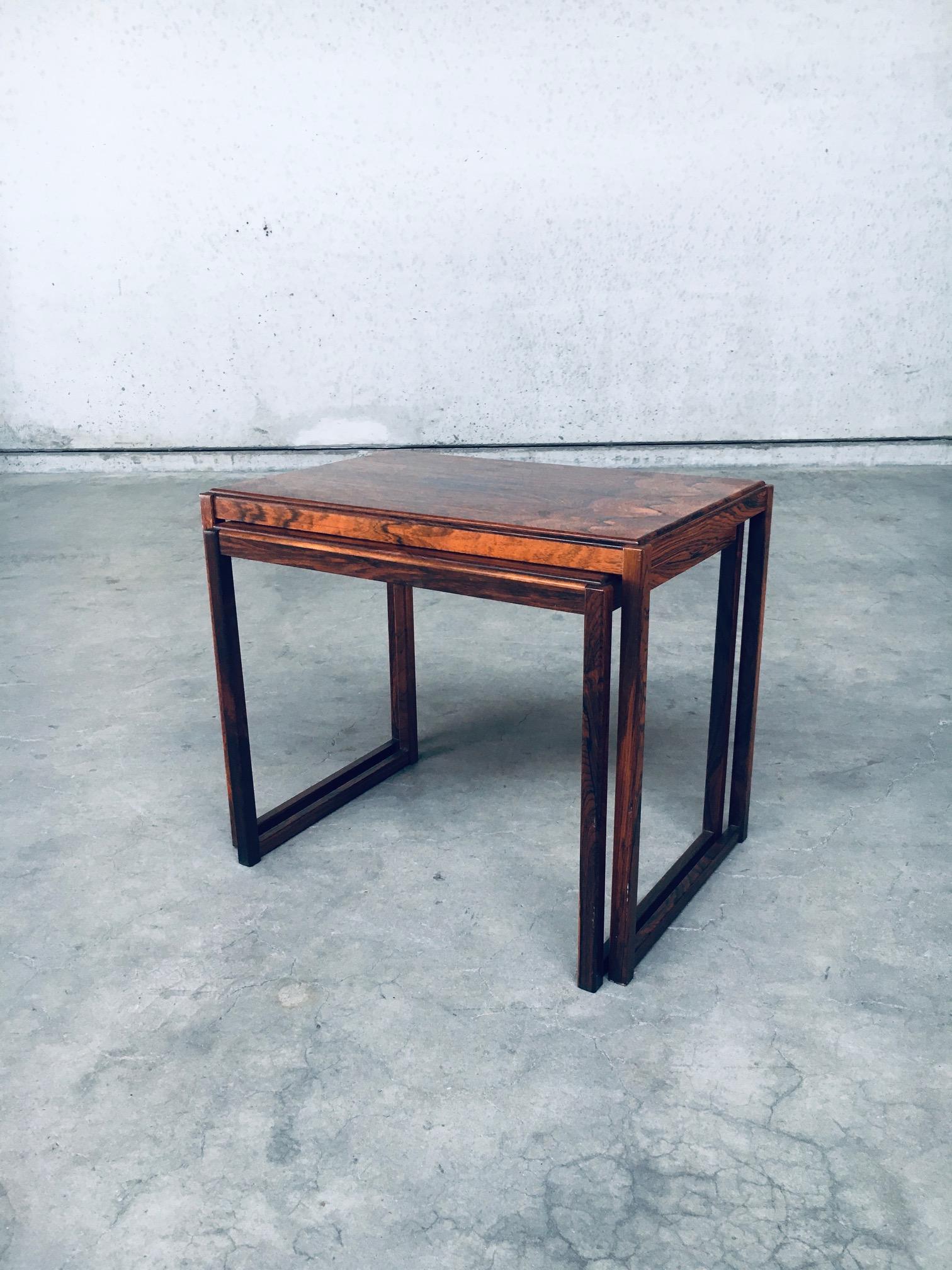 Vintage Mid-Century Modern Scandinavian Design Nesting Table set of 2. Made in Denmark, 1960s. Palisander style wood constructed side nesting table set. In very good original condition. These Measure: large: 53cm x 63cm x 42cm - medium: 49,5cm x