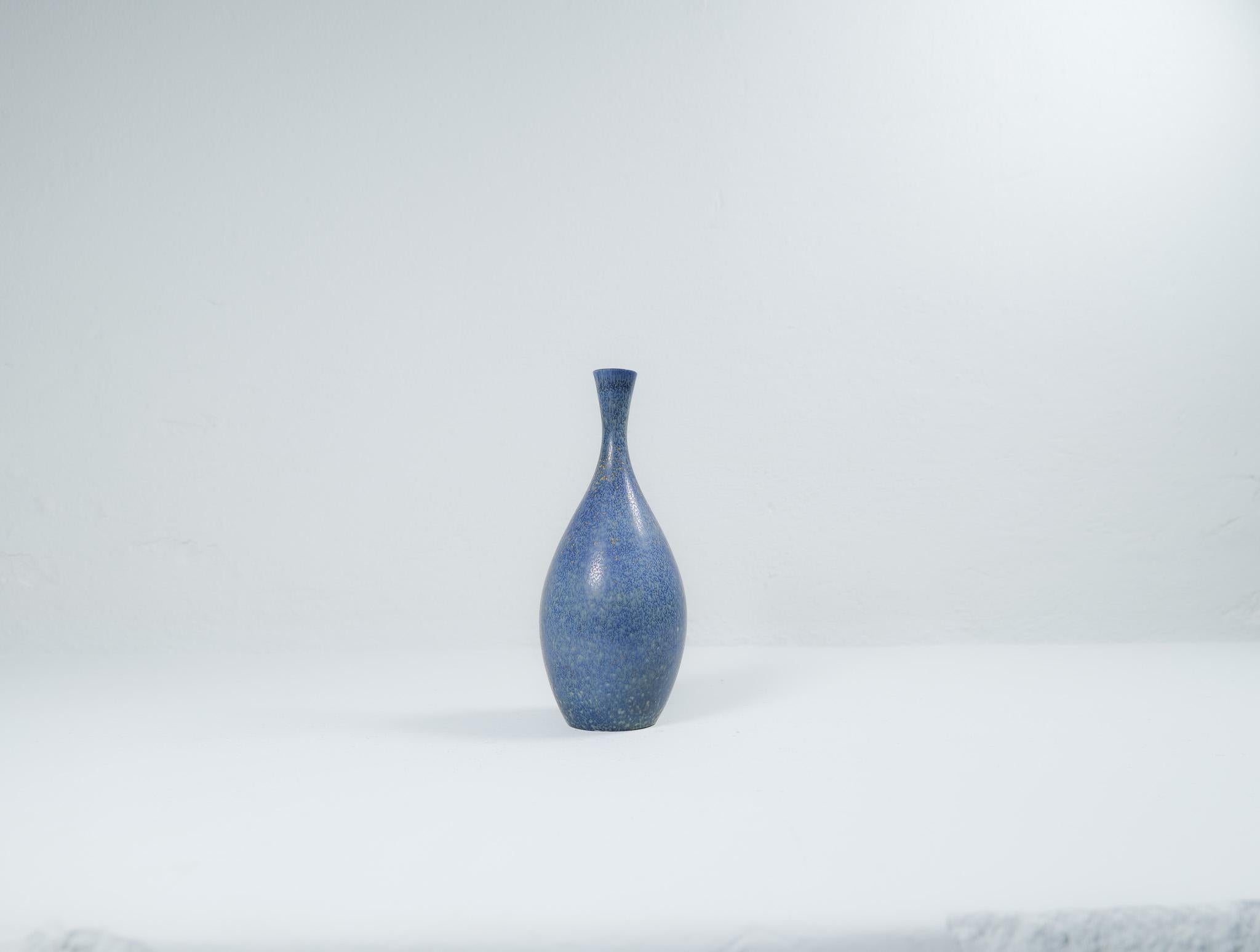 This stunning and not so usual piece of ceramic was produced at Rörstrand and maker/designer Carl Harry Stålhane. Made in Sweden in the 1950s. Exceptional beautiful blue glazed vases with nice lines. Its rounded bottom with blue glaze and