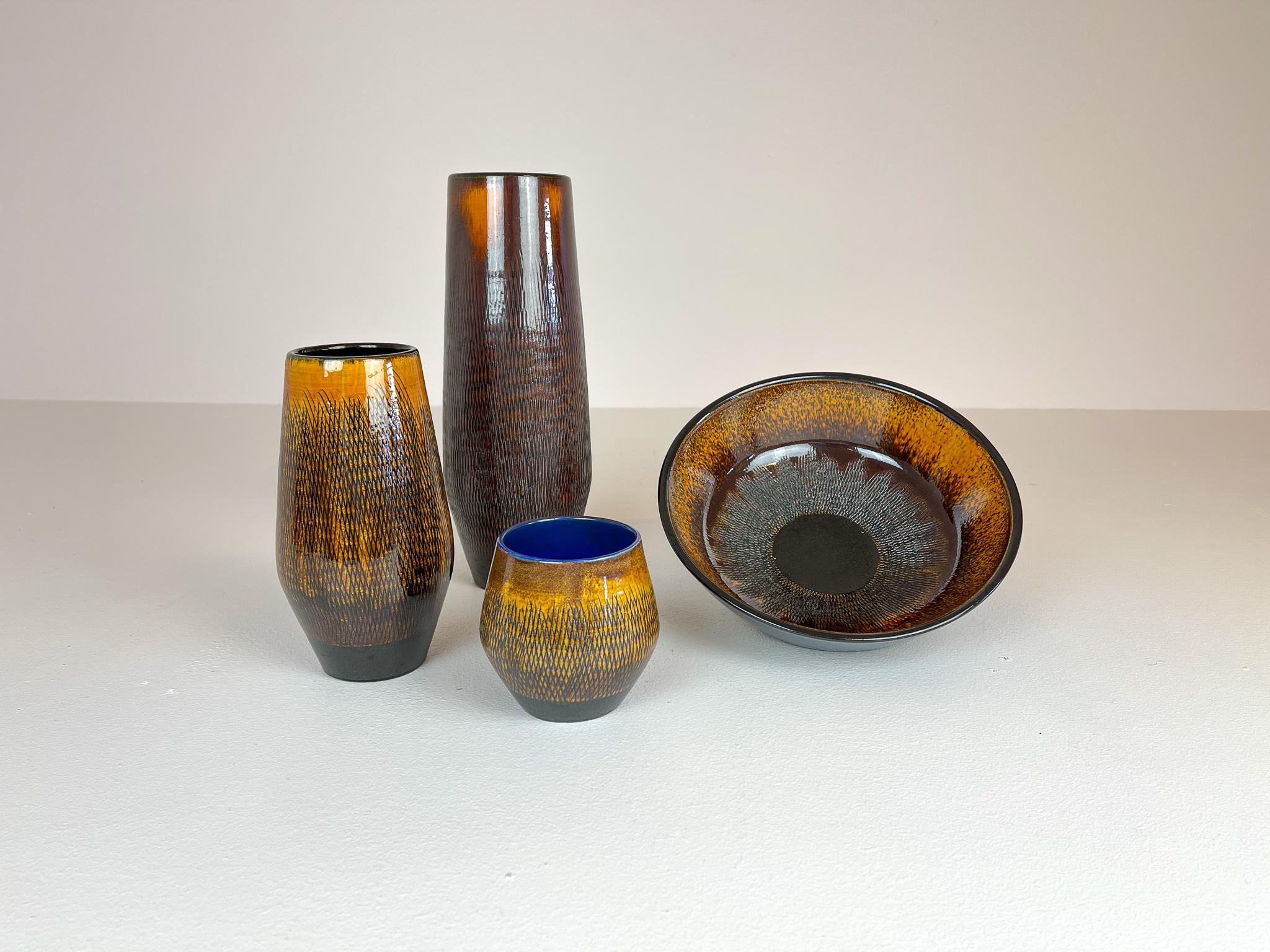 Ingrid Atterberg is the creator of these vases produced in Sweden at Upsala Ekeby in the 1960s. Wonderful sculptured with a nice glaze. 

Good condition.

Dimensions. The large H 31 cm, D 10 cm, middle size H 20 cm, D 10cm, small H 10, D 11 cm.
