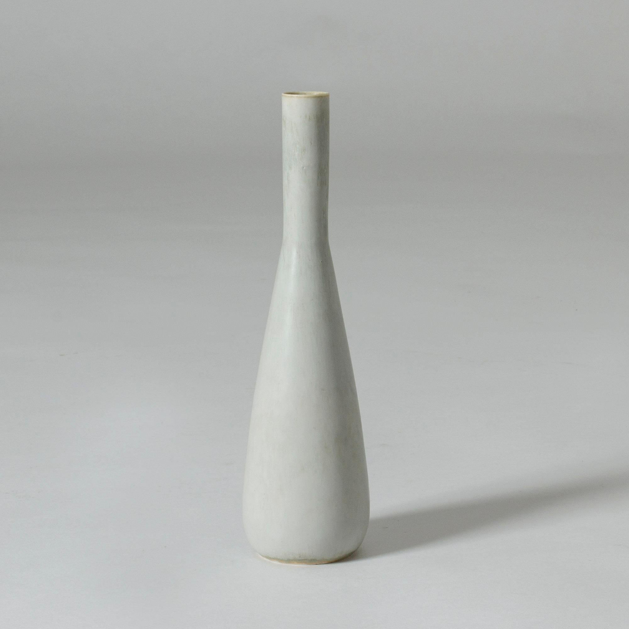 Elegant unique stoneware vase by Carl-Harry Stålhane. Slender shape and a pale, grey glaze.

Carl-Harry Stålhane was one of the stars among Swedish ceramic artists during the 1950s, 1960s and 1970s, whose designs are just as highly regarded and