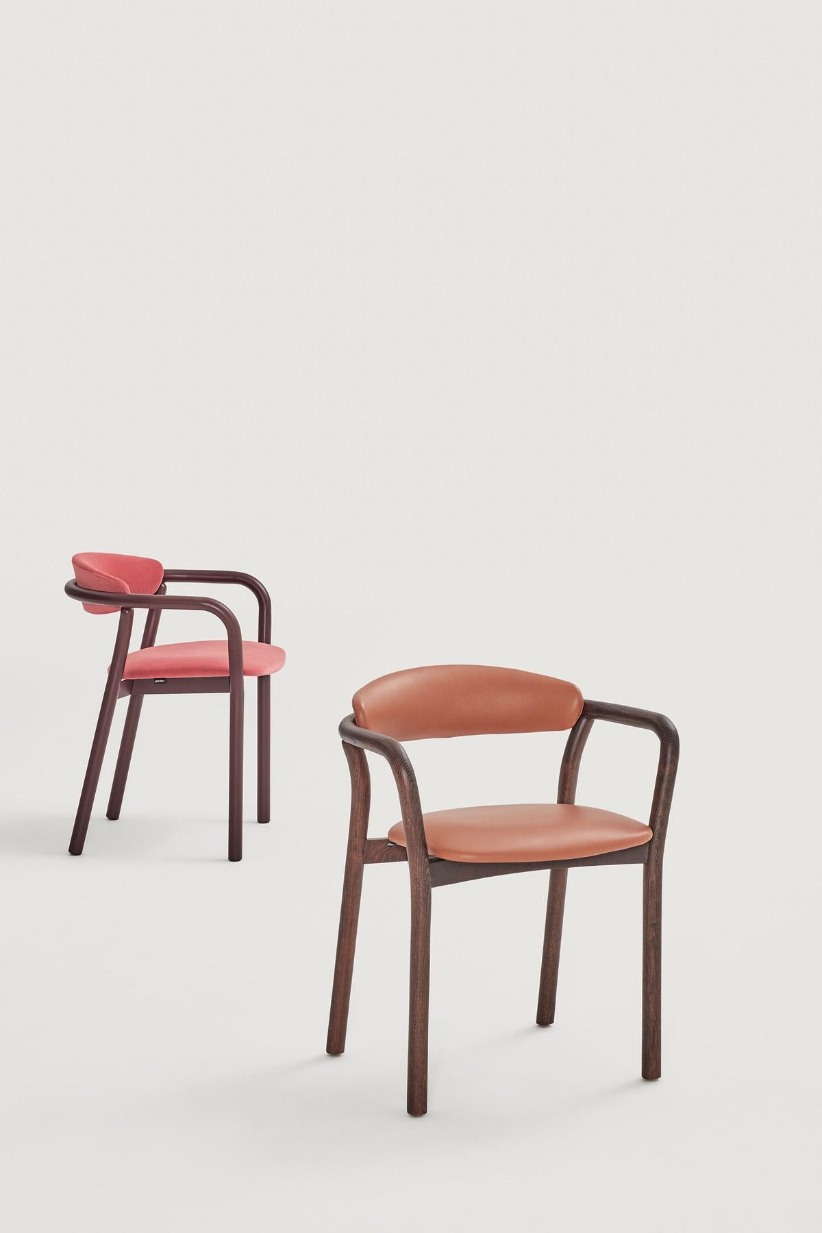 This thoughtfully designed chair features organic, inviting forms that exude a timeless appeal. Crafted with exceptional care, these chairs prioritize both comfort and understated elegance. Their versatility allows them to seamlessly integrate into