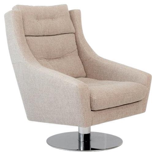 This swivel lounge chair embodies both form and function in its design. Inspired by functionality, its ergonomic shape offers support while exuding a touch of class in any setting. With a cushioned back and seat, it offers supreme comfort. Available