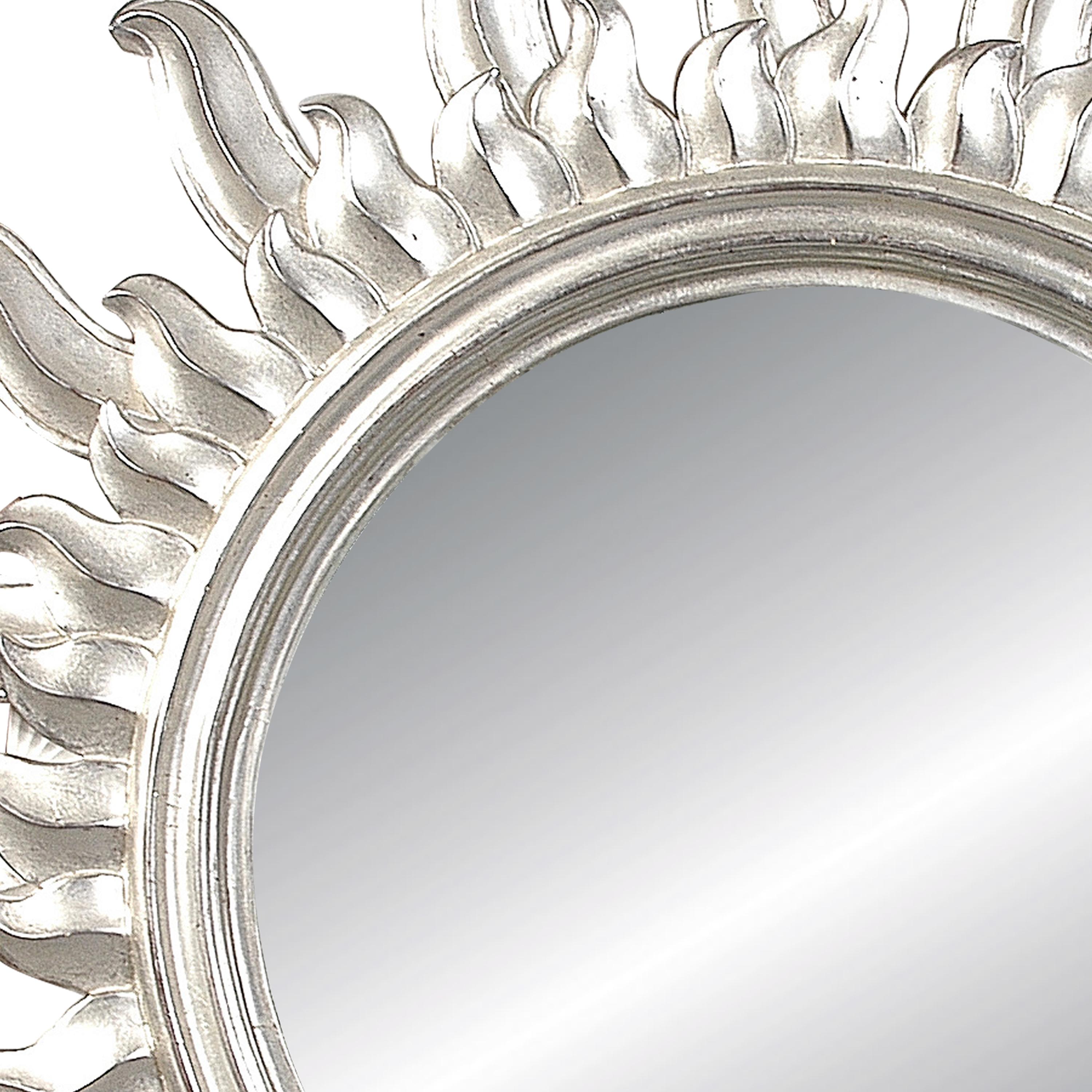French sun form mirror, carved by polychrome hand finished in a silver bath.
  