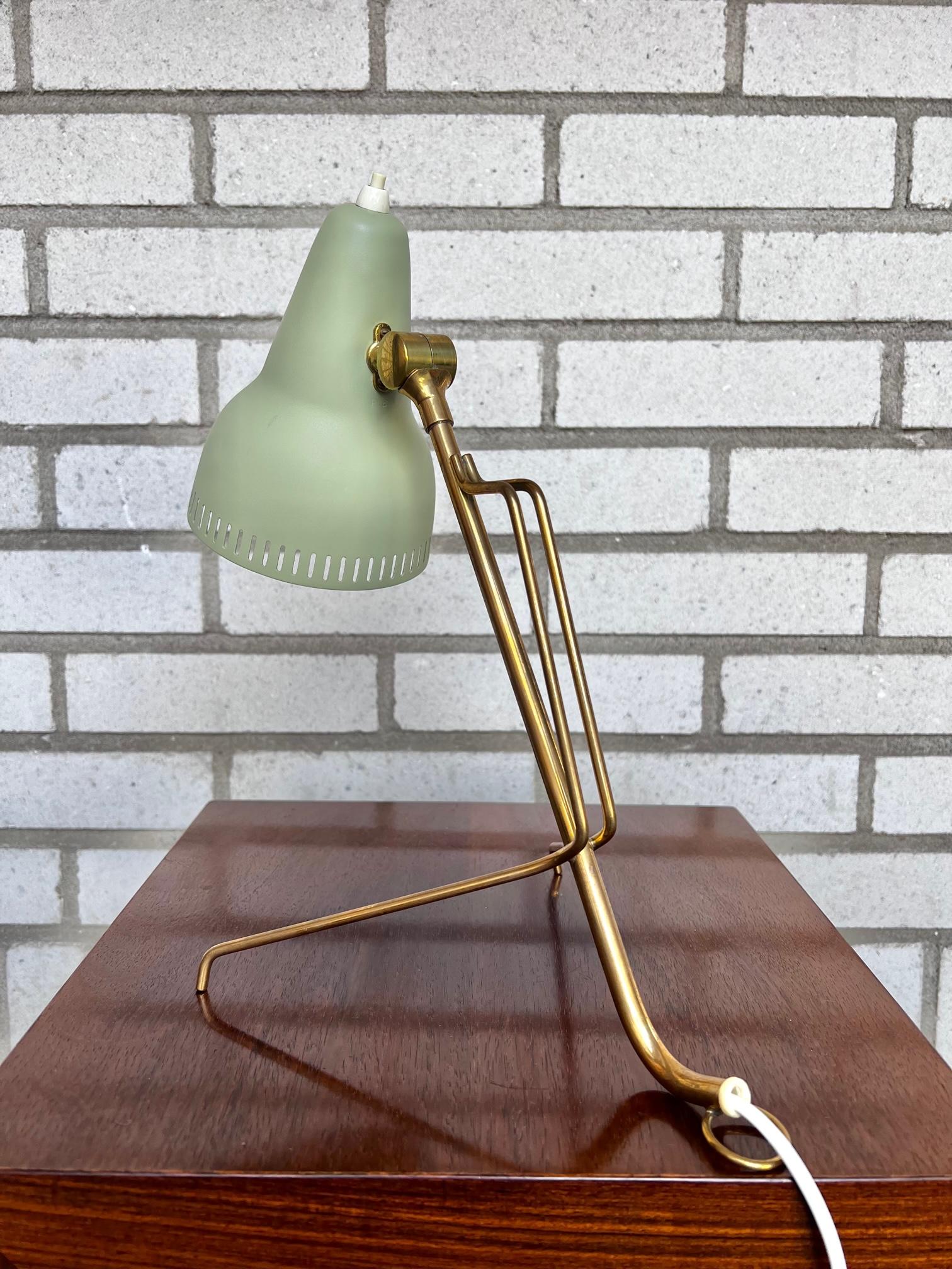 The lamp is manufactured by Falkenbergs Belysning in 1950-60s. The lamp consists of a brass base with the light source hidden by a green perforated metal shade. The lamp is due to its age in very good condition. 

The lamp could both be used as a