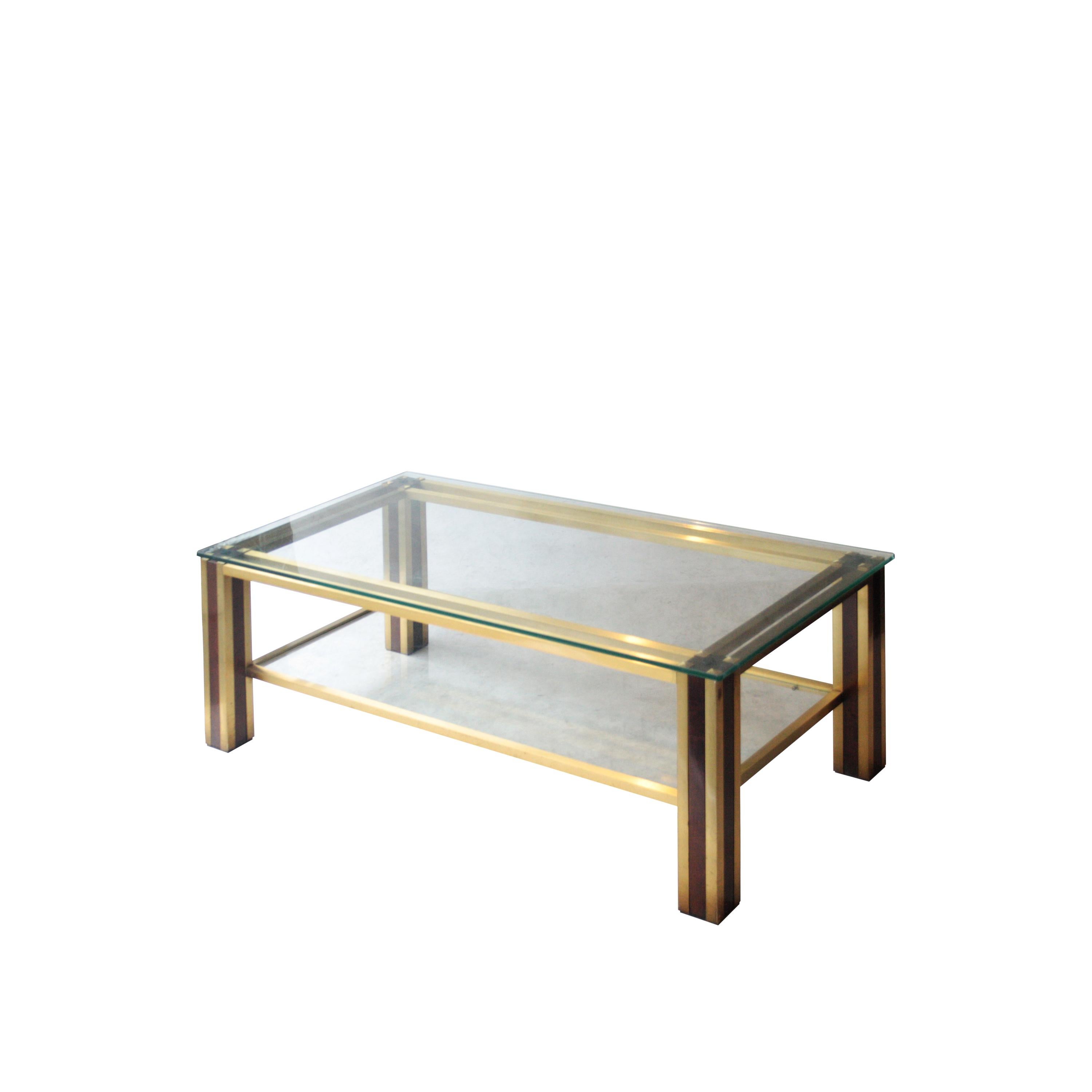 Coffee table with brass structure and solid wood with top and bottom shelf glass, brass details finished in a pyramidal shape.
 