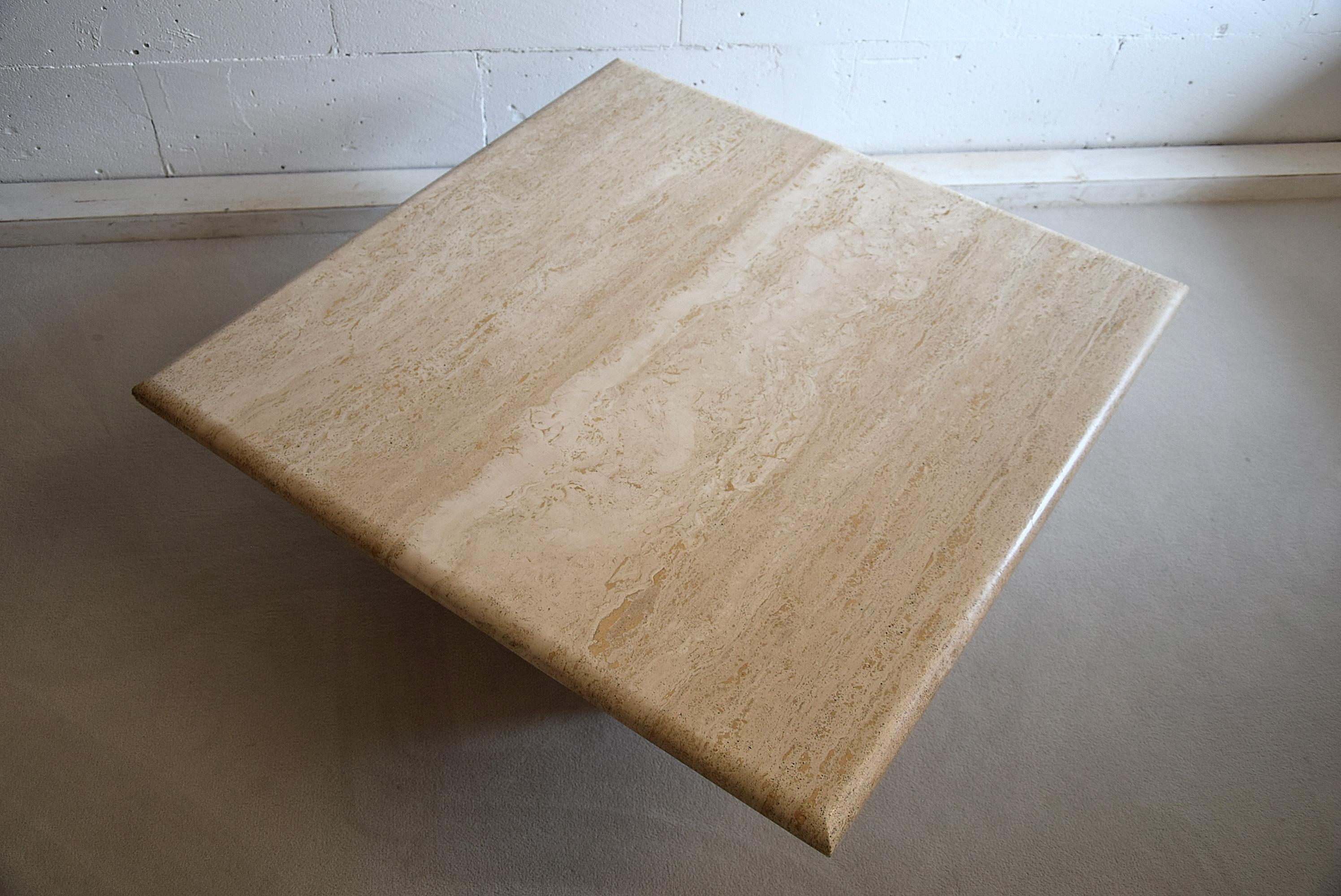 Gorgeous and stylish Travertine Mid-Century Modern coffee table in fantastic condition. The 4 square Travertine legs can be positioned as you please. In the center as we did or at the corners if you prefer.
This table will be shipped overseas in two