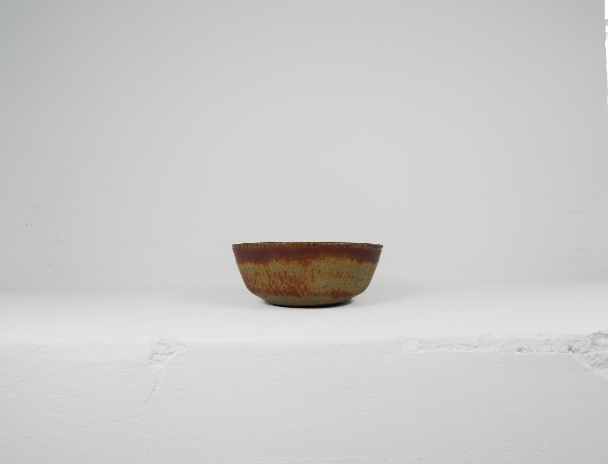 This large unique bowl has a wonderful glaze. It’s made in Sweden at Rörstrand and designed by Carl-Harry Stålhane. There is only one of its kind and is therefore a spectacular piece to own. Its stunning in its design and deep glaze pattern. Signed