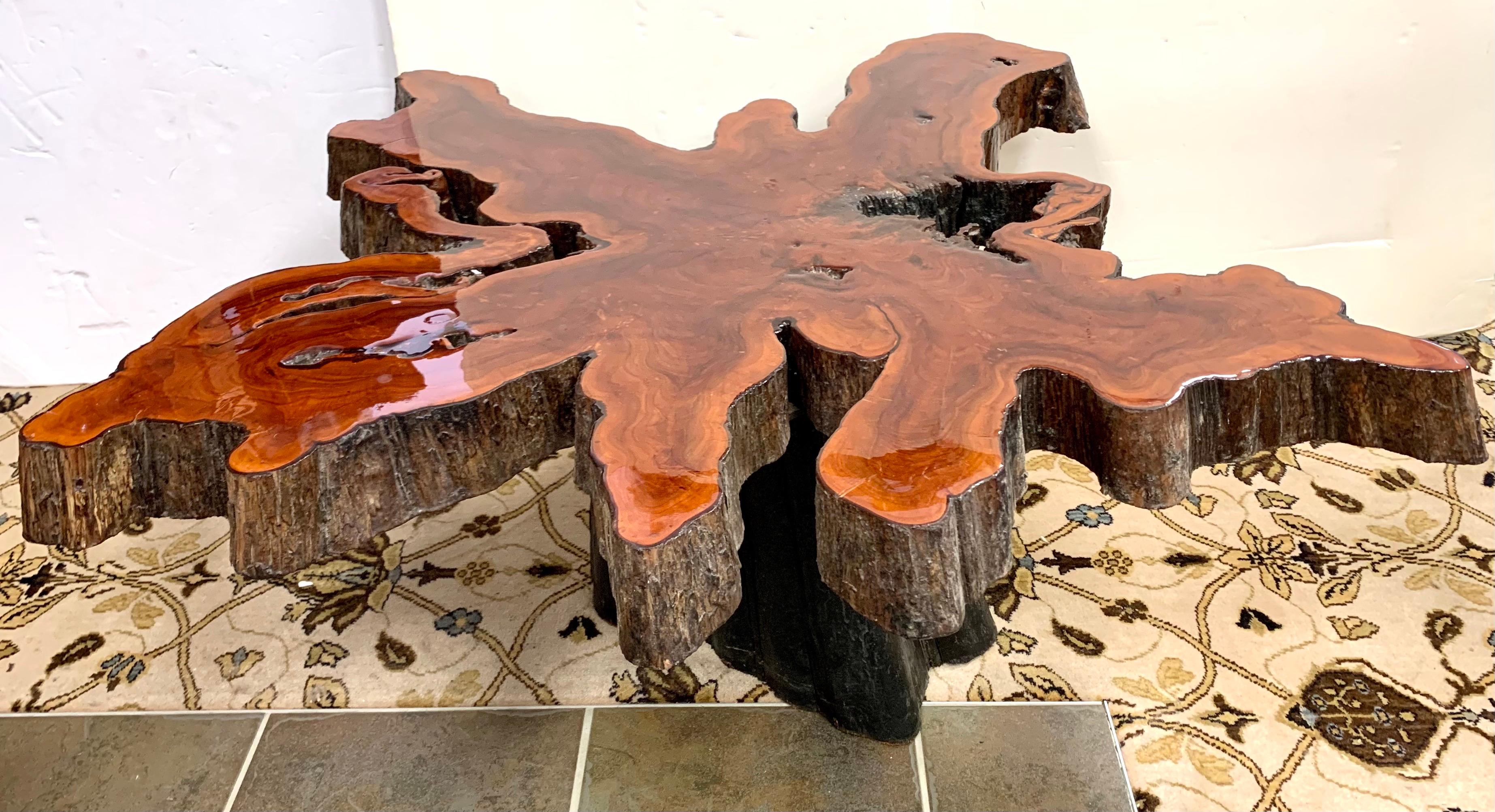 Vintage large mid century 1960’s organic live edge end table made of an impressive single slab of wood with a black tree trunk base. Great scale at 41 x 44 x 18.5 tall and better lines.