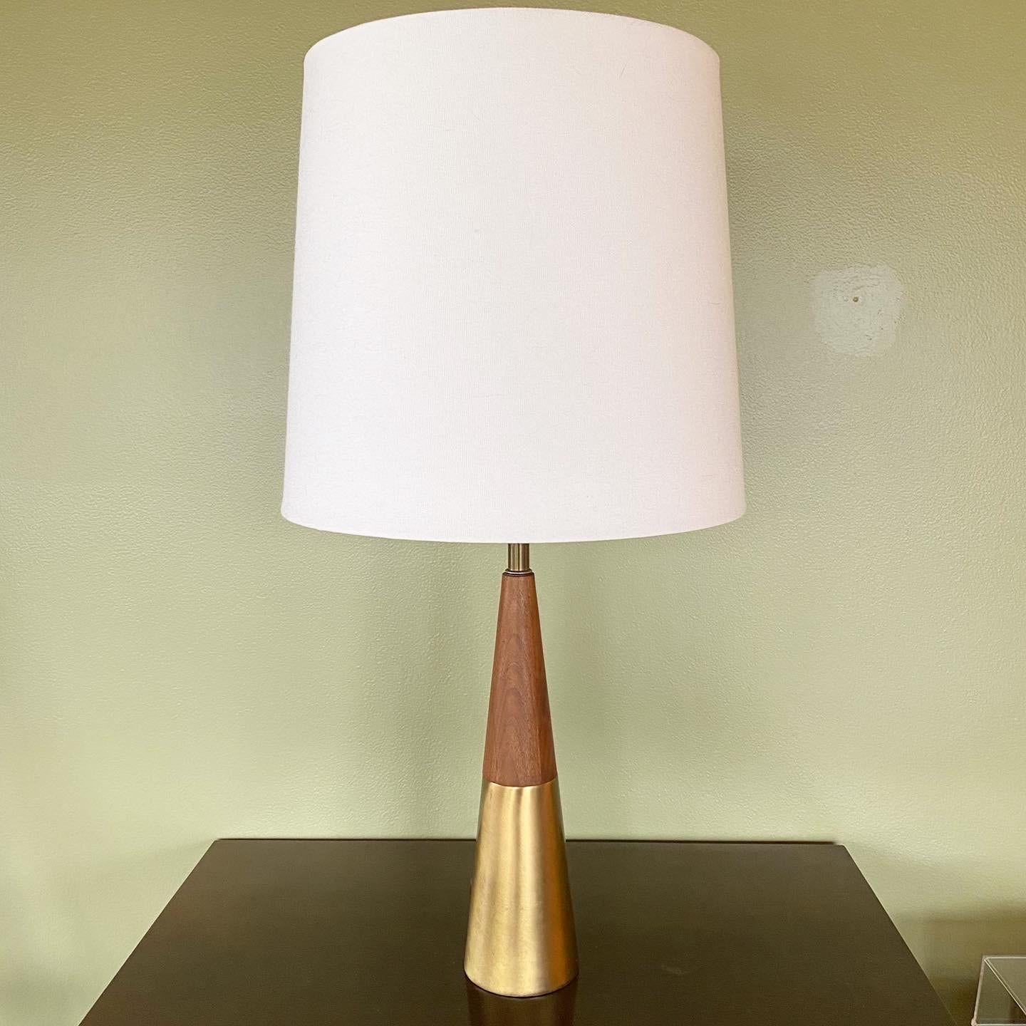 This is a beautiful vintage Midcentury Modern Model D390 Walnut and Brass Lamp Designed by Tony Paul for Westwood Industries, ca. 1958. This size is so accommodating to nearly any room. Whether it's an entry way, bedroom lamp, corner living room