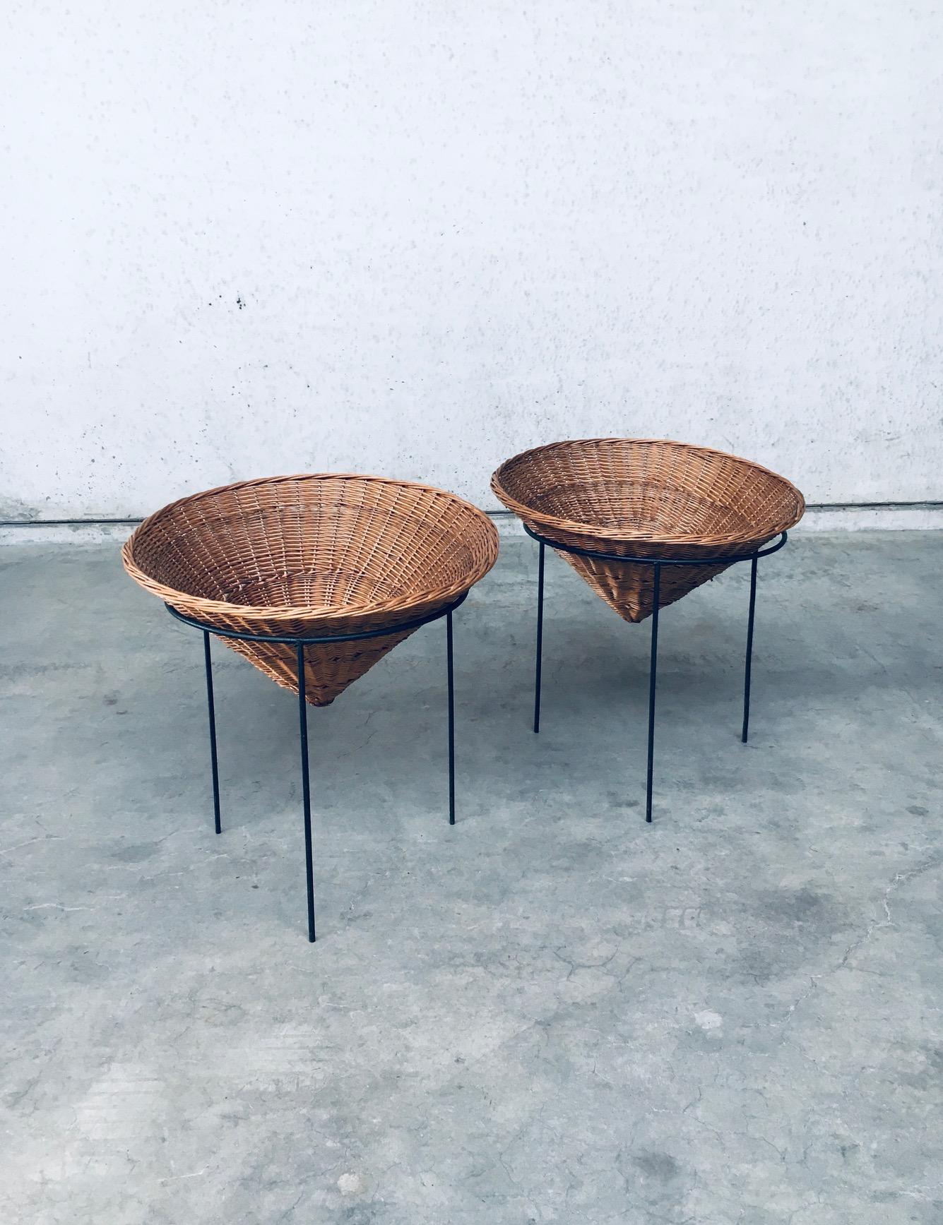 Vintage Midcentury Modern Dutch Design Wicker Tripod Baskets. Made in the Netherlands, 1960's period. Cone wicker woven basket with steel tripod base. These were used as shopping display baskets to store anything from socks to toys. Loose wicker