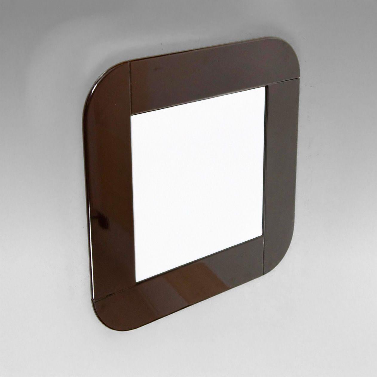 Midcentury Modern Laquered Brown Square Mirror, Italy 1980s

A beautiful expression of 1980s Italian design, this vintage square mirror features a beautifully crafted laquered wooden frame in a rich dark brown finish, reflecting the elegant