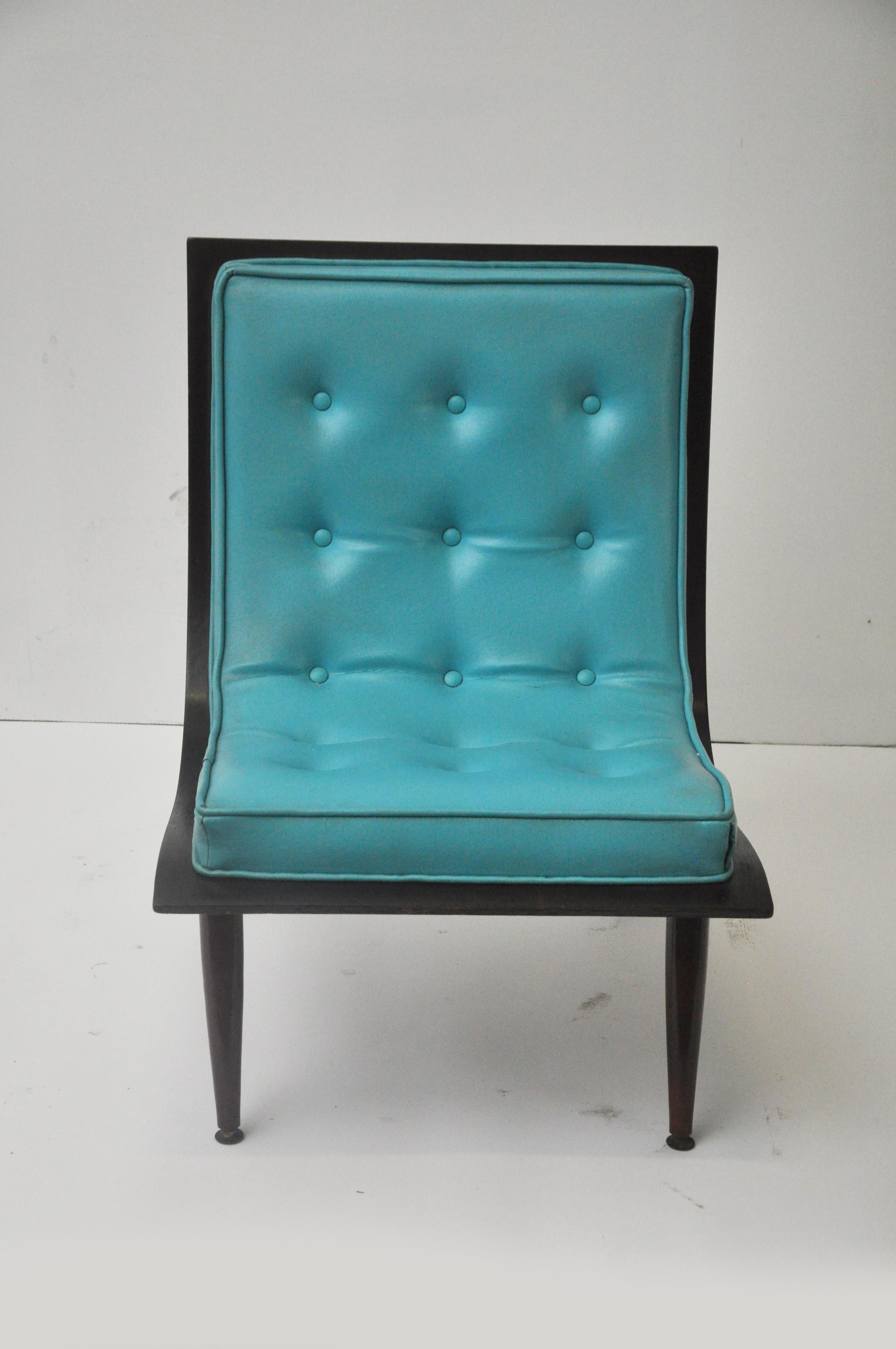 Upholstered lounge chair manufactured by Carter Brothers Inc. Original teal vinyl tufted upholstery with walnut back.
 