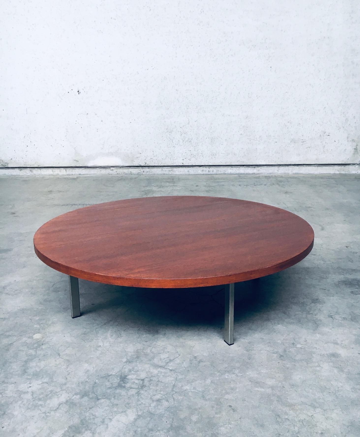 Vintage Midcentury Modern Dutch Design XL Round Coffee Table by Pastoe. Made in the Netherlands, 1960's period. XL round veneer covered top with 4 square metal feet. Has it's original Pastoe label on the underside. The top has been refinished. Comes