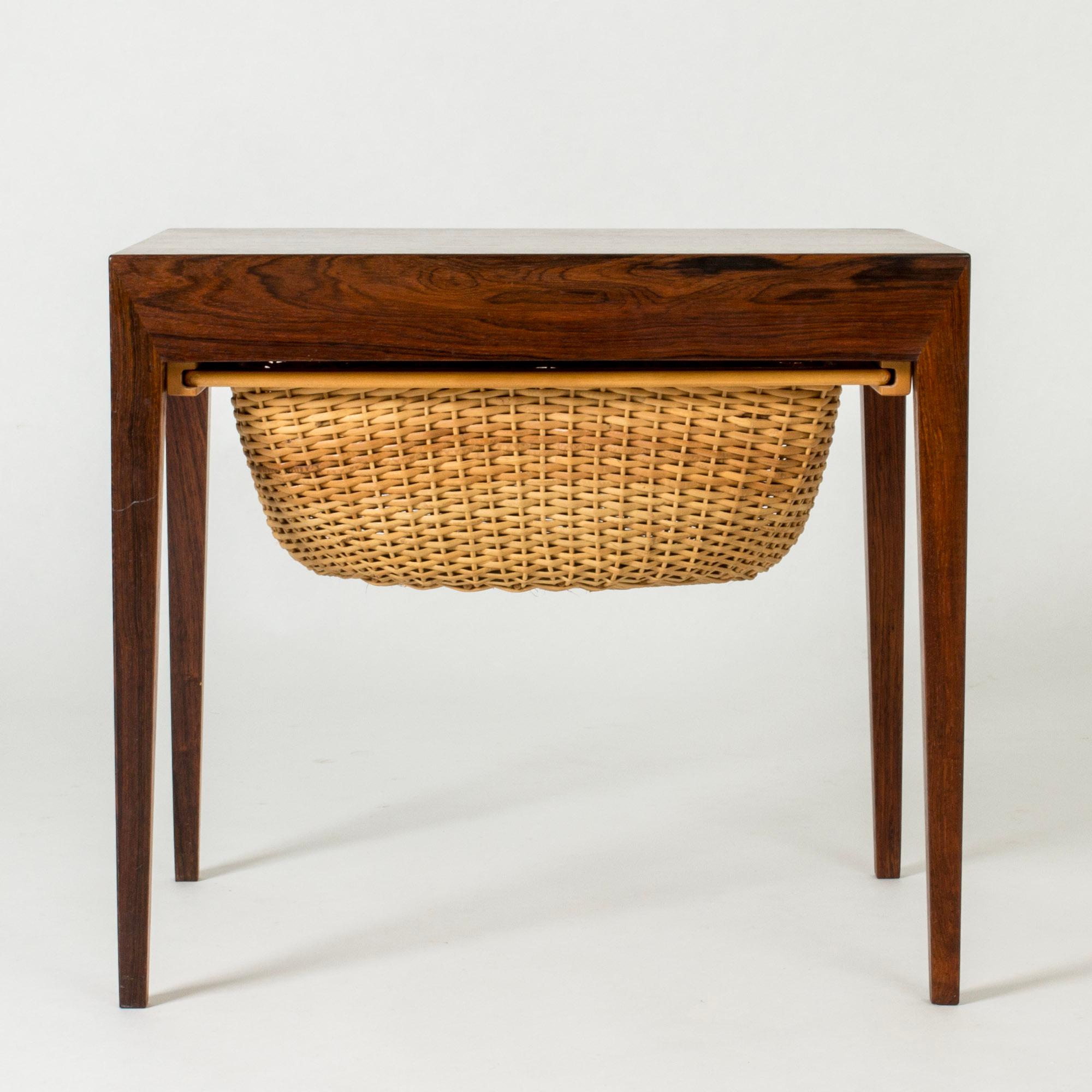 Lovely rosewood side table by Severin Hansen with a wicker basket drawer. Great for storage and creating a great silhouette. Severin Hansen’s characteristic diagonal, seamless joinery at the corners.